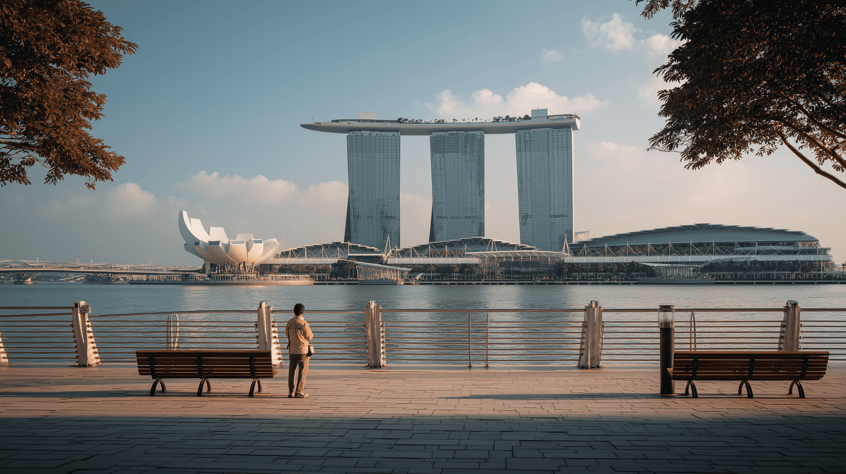 A green butterfly rests on a flower.