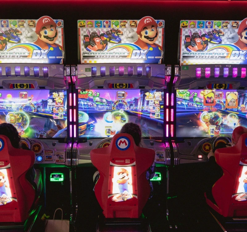 A drum arcade game played by two people with drumsticks