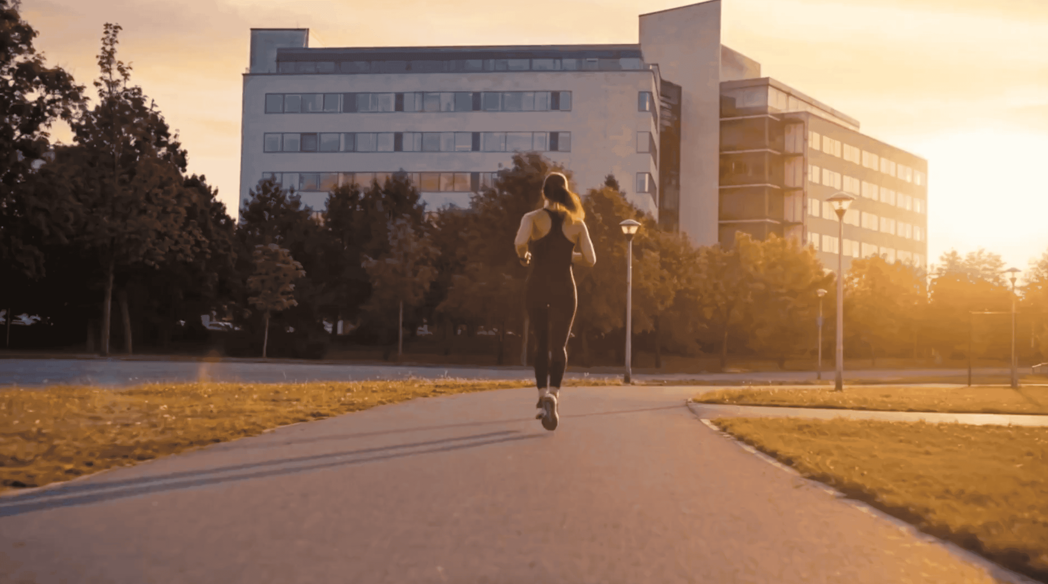 Running women in front of an office building