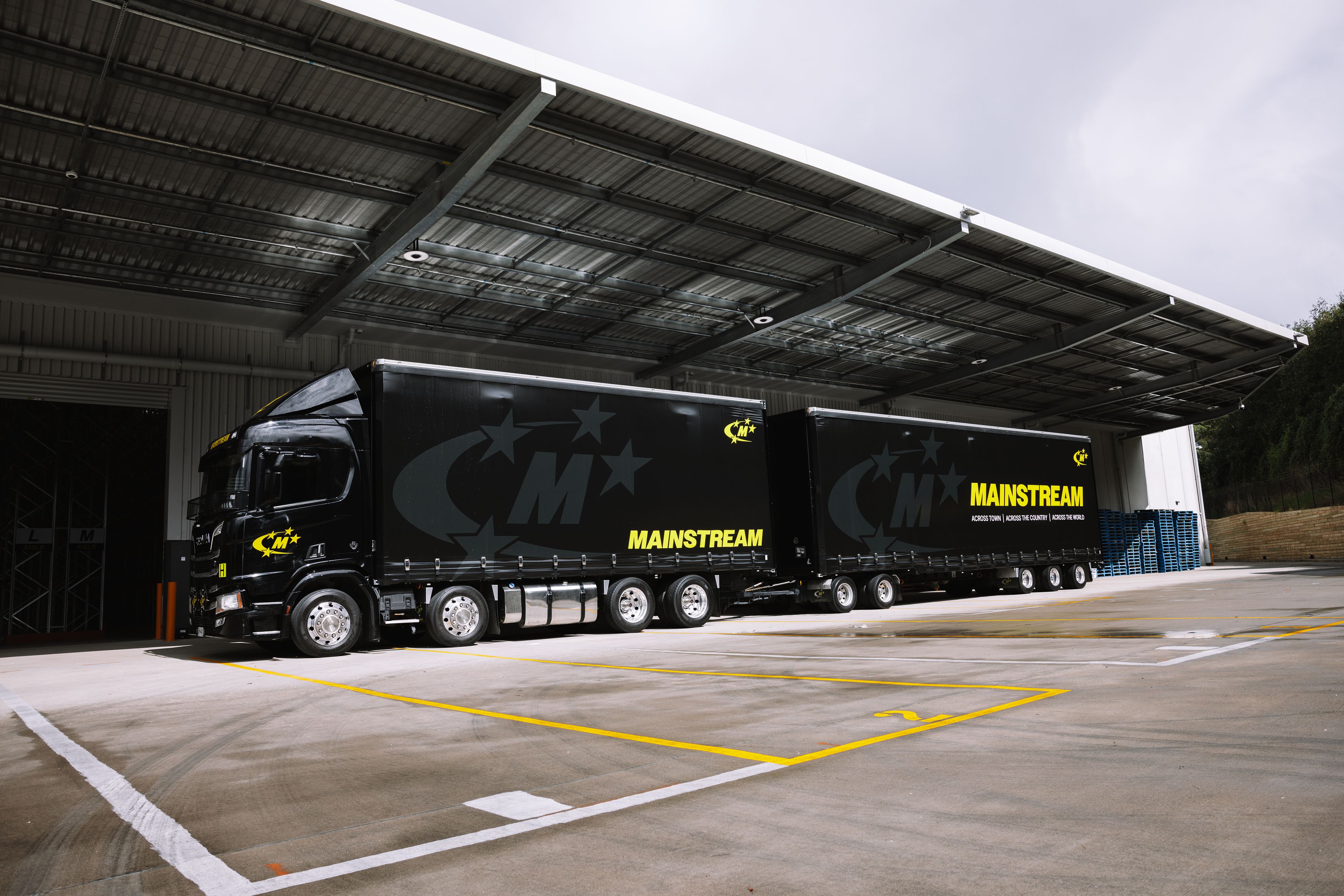 Wind turbine towering over agricultural fields