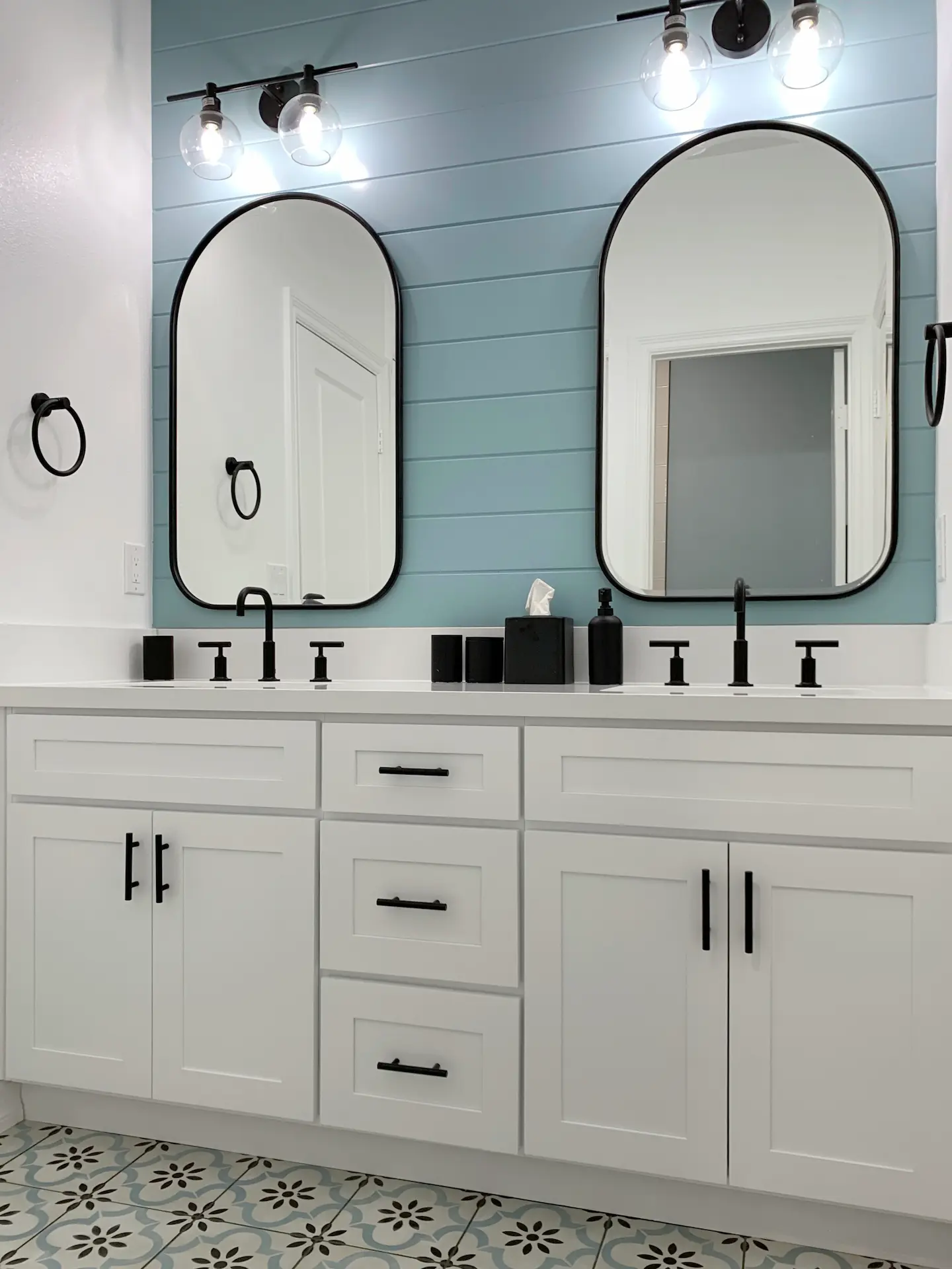 Wide view of the kids' double vanity, showcasing the sleek design with Quartz countertops and undermount sinks in this contemporary bathroom. Photo by Todd Huge.
