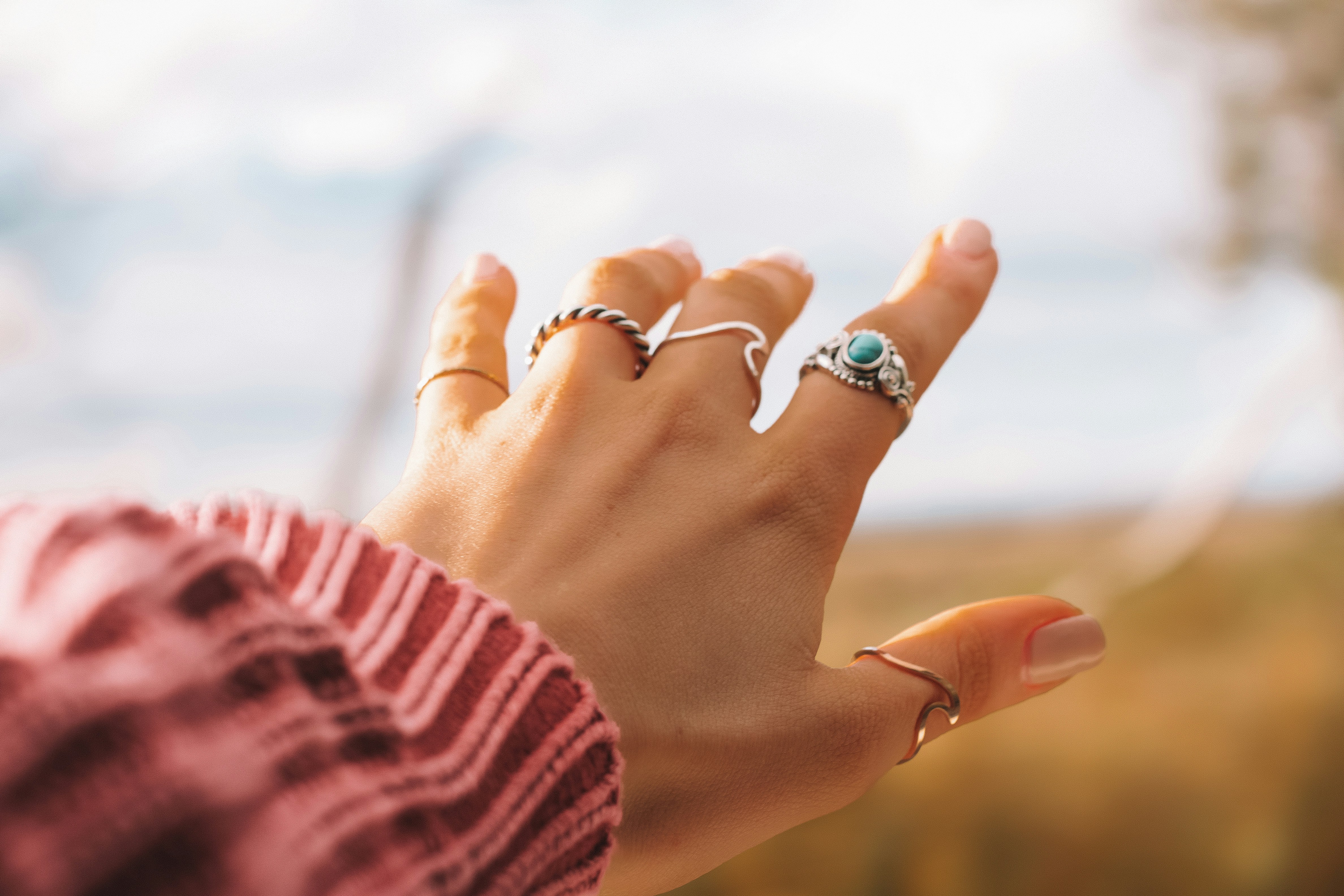 Hand with Different Rings on it - What Color Jewelry Should I Wear