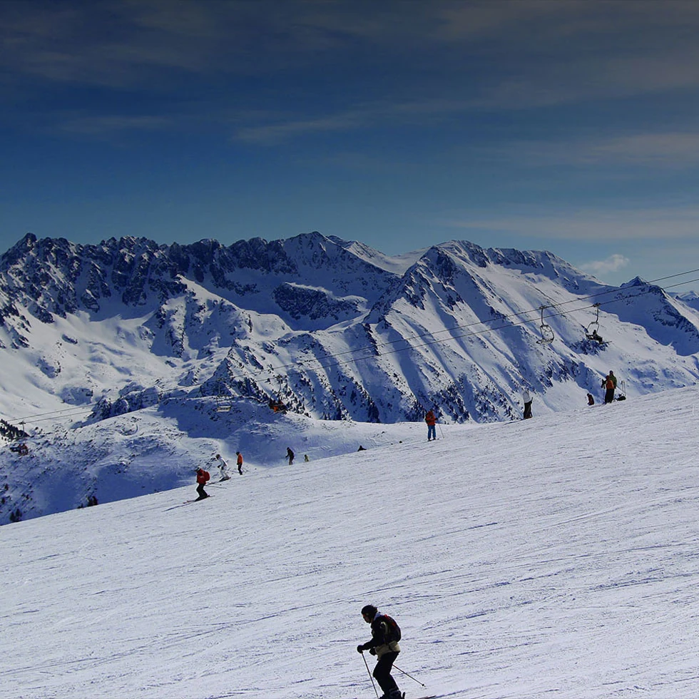 Bansko mountain slopes beneath a blue winter sky