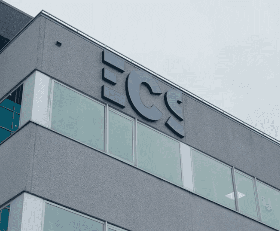 Documents and planning materials on a desk, representing customized solutions tailored to client needs.