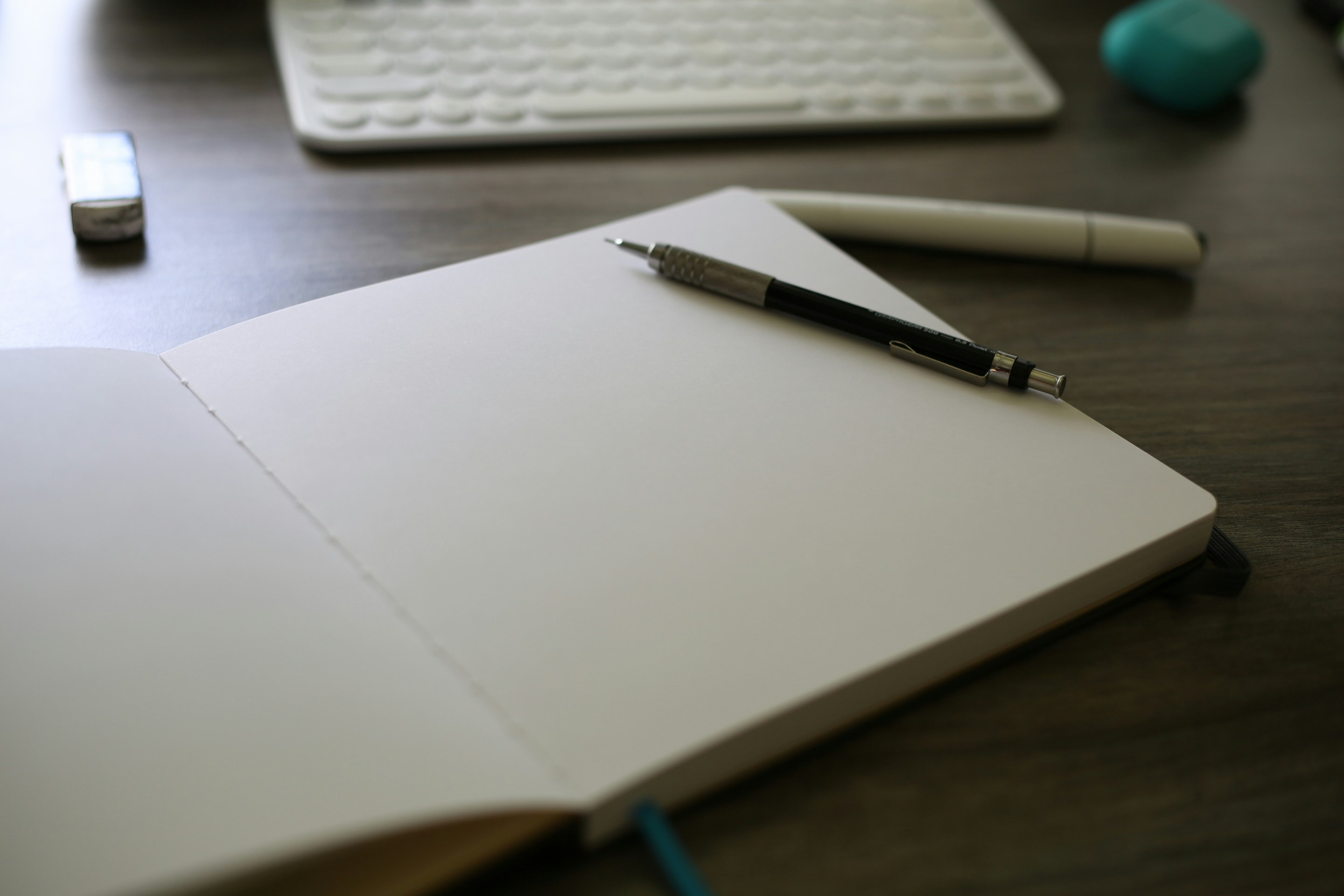Desk workspace with papers and office items in a quiet room.