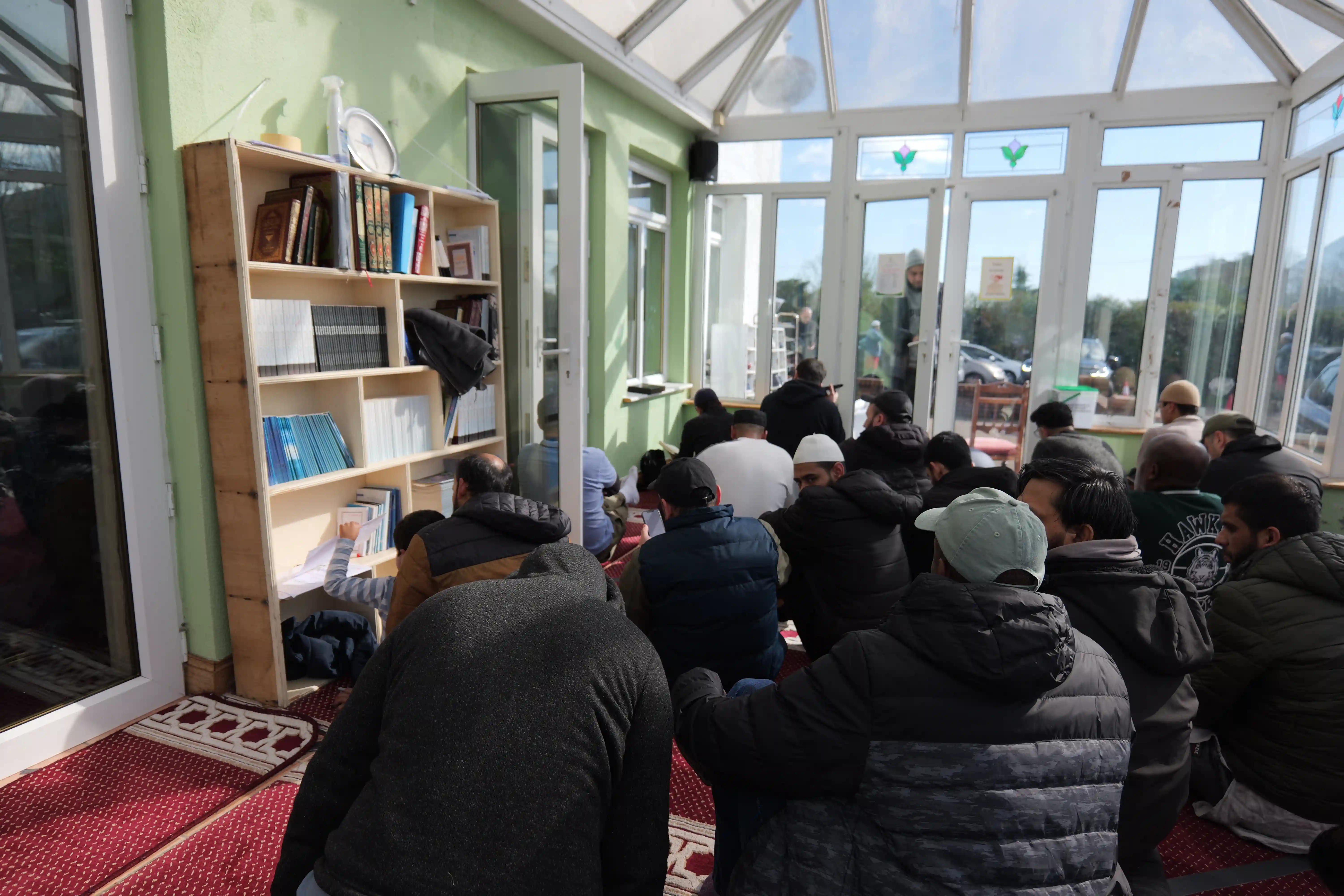a black and white living room with a large tv