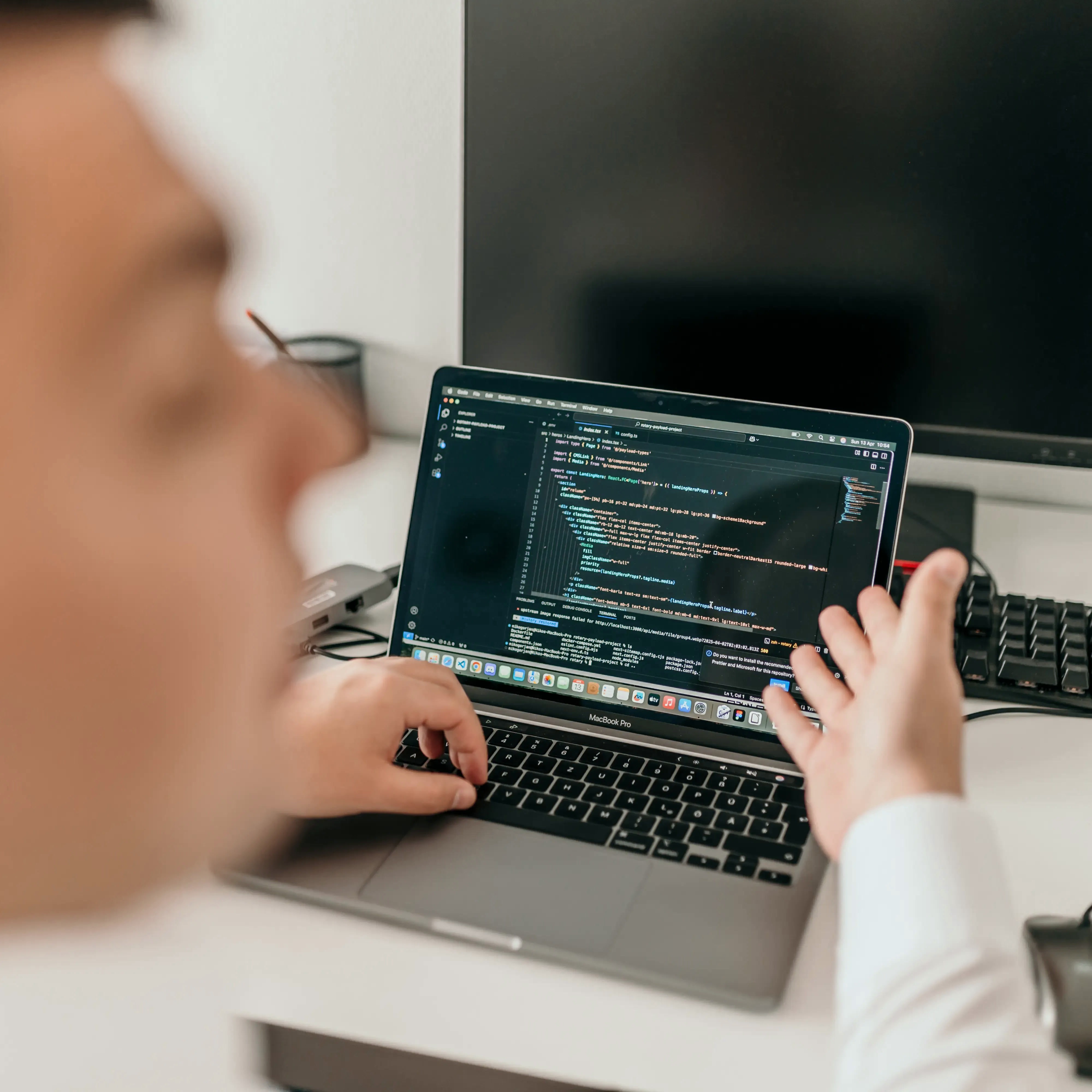 Minimalist brushed-steel chair in a white corner studio—industrial, brutalist modern furniture.