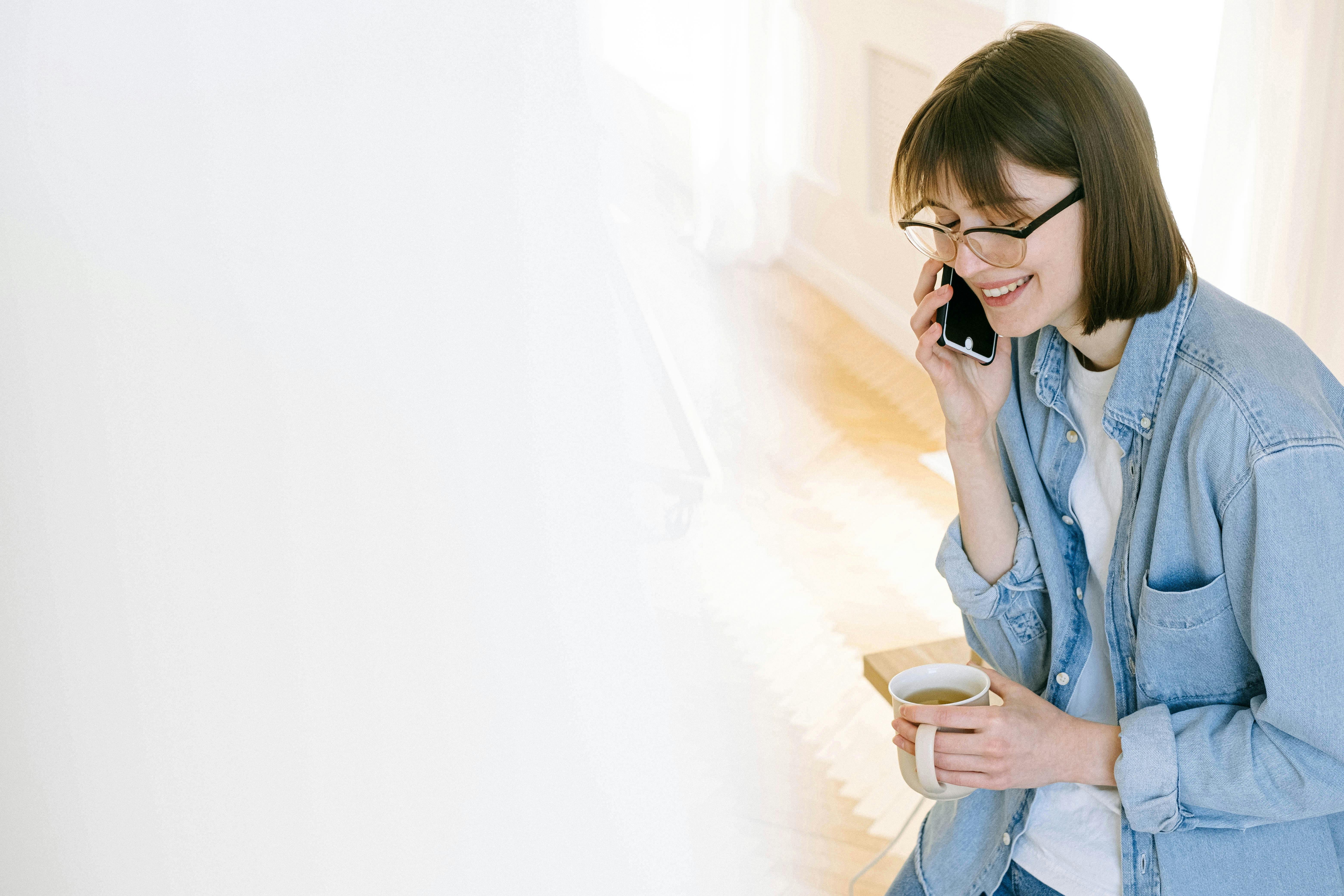 Woman on phone talking with owner of guesthouse