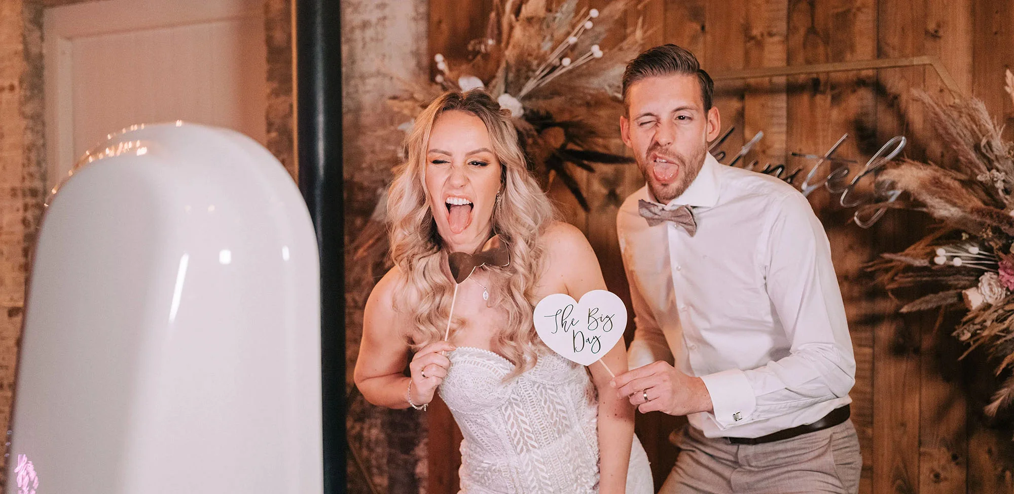 Wedding posing for the photo booth