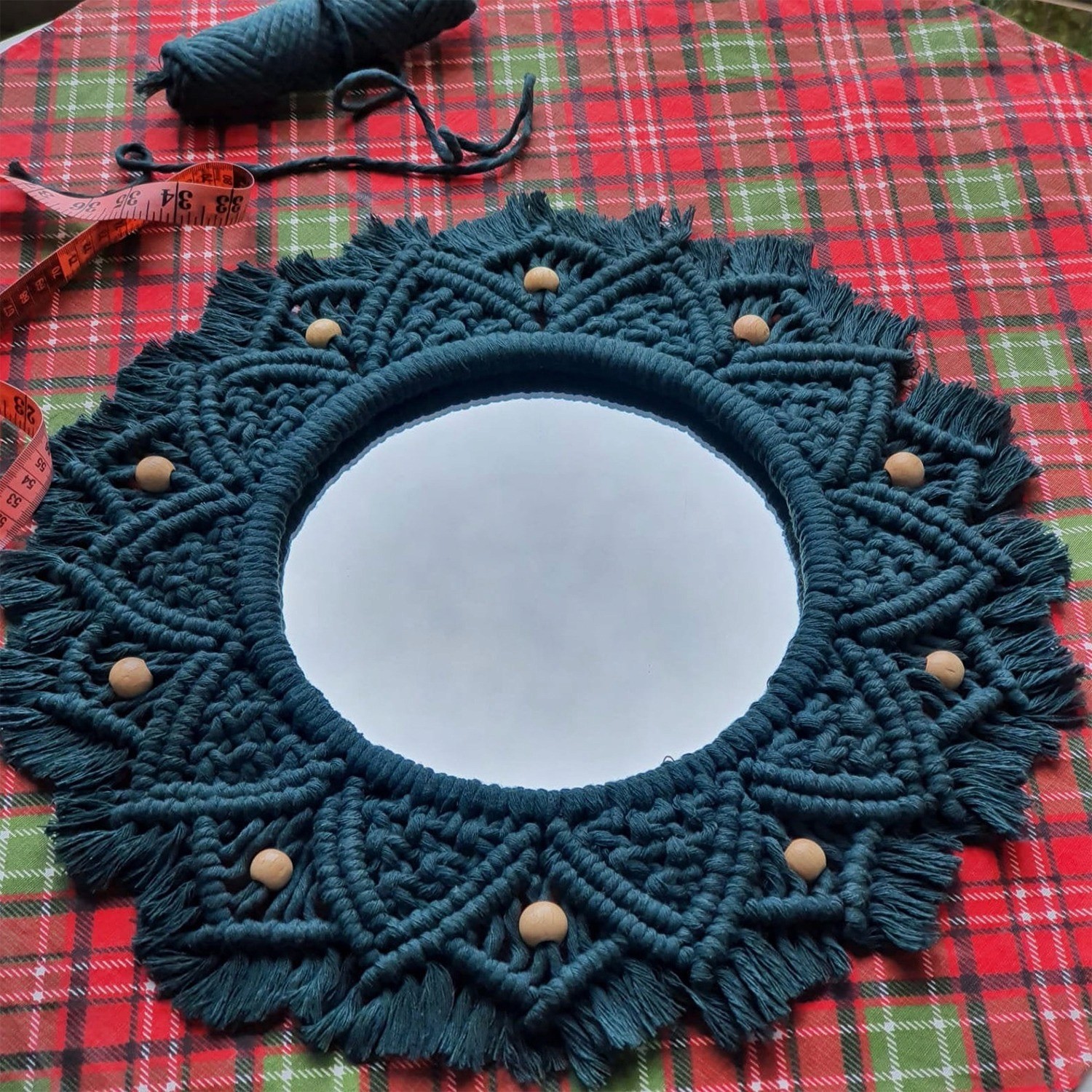 Dark blue macramé wall mirror with wooden beads