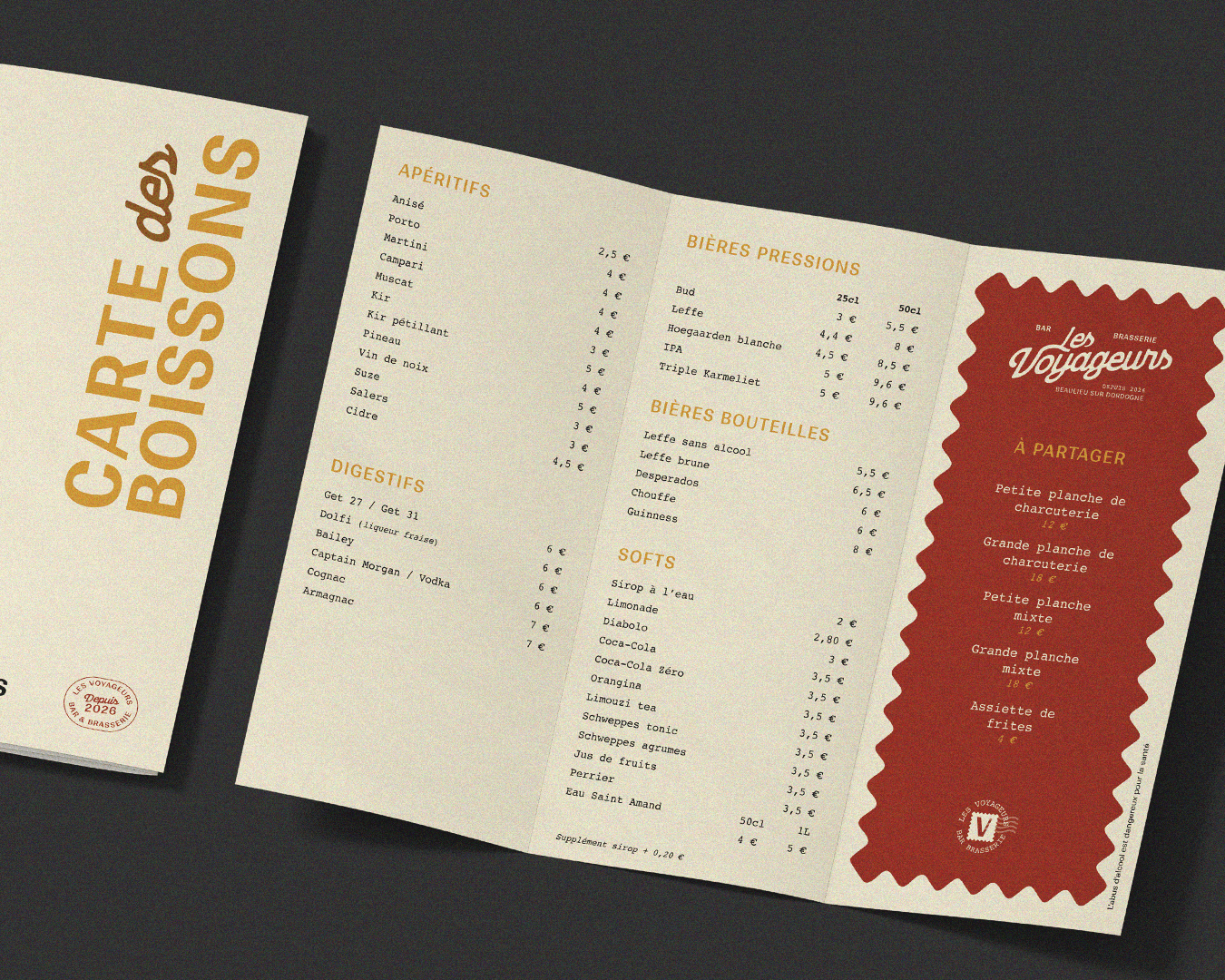 Modern home office setup with a monitor, ergonomic chair, keyboard, and indoor plants near a window with blinds.