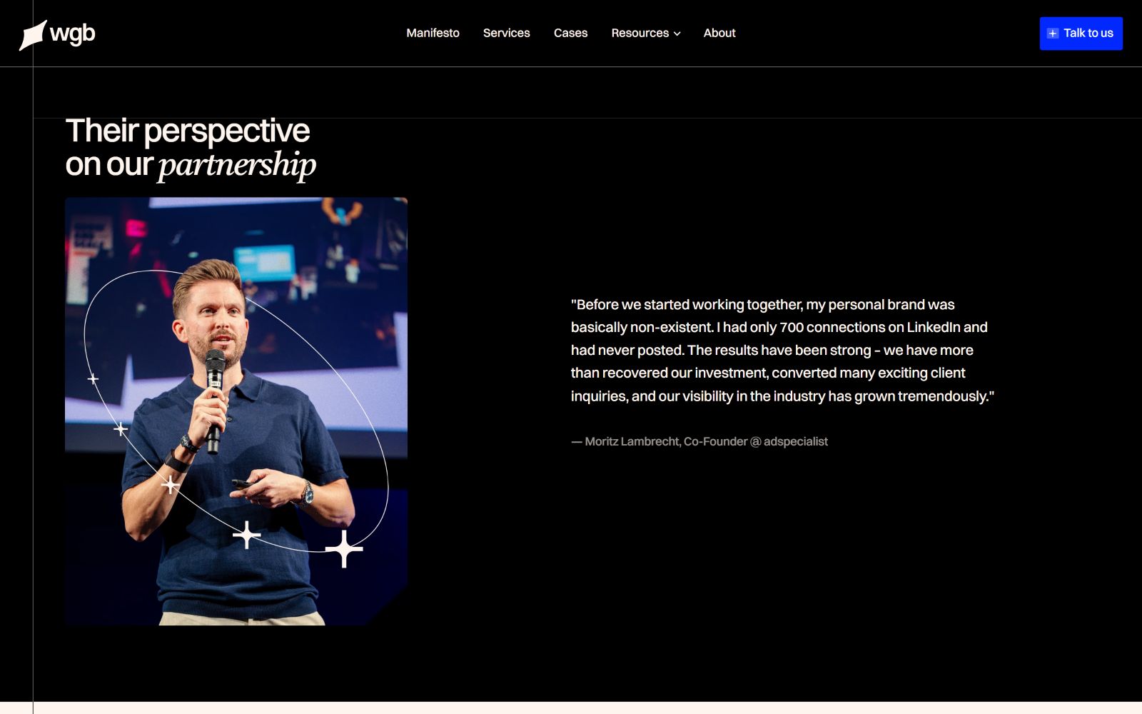 Man speaking on stage with a microphone. Quote about partnership success displayed on a dark background next to the image.