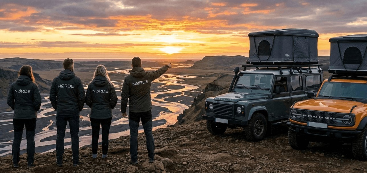 Person standing at a steamy food stall at night.