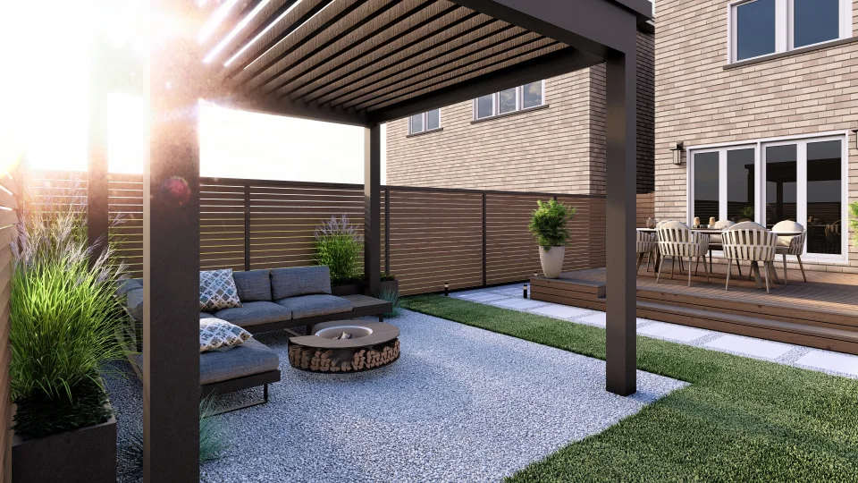 A modern backyard patio area featuring a pergola with a lounging area underneath, sectional sofa, round fire pit, and a separate wooden deck with a dining set. The space is bordered by wooden privacy fencing and includes small grassy areas, decorative pebbles, and potted plants.