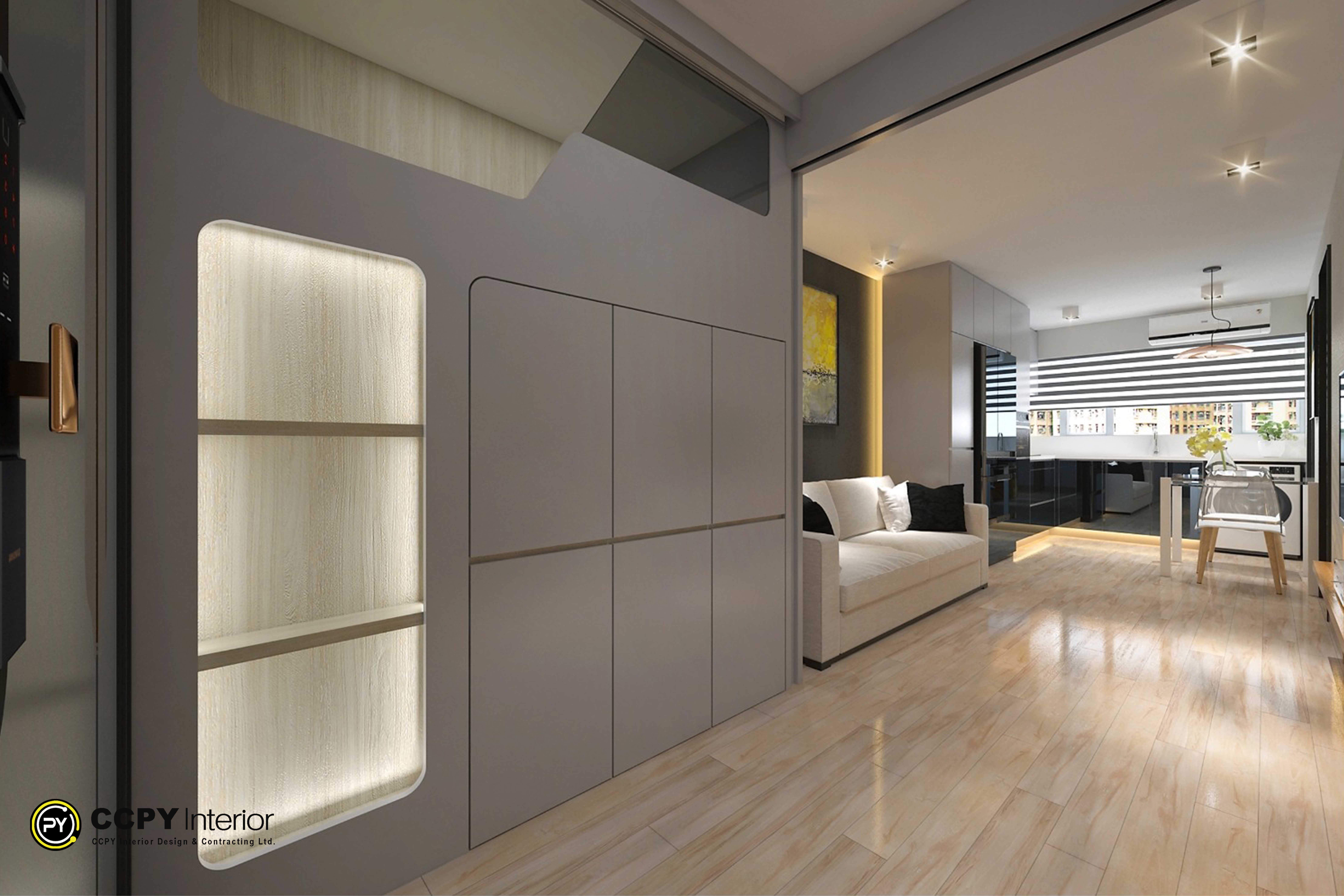 he selected region displays an understated minimalist living space featuring sleek full-height custom cabinetry, a neutral color palette, and warm integrated LED strip lighting.This project is a public housing estate renovation in Hong Kong located at Pok Hong Estate, Pok Tai House (House C), designed by CCPY Interior Design (鍵誠室內設計工程有限公司).Project Design HighlightsSpatial Transformation: The unit is a 381 sq. ft. flat renovated into a modern London studio-style layout optimized for a 2-person household.Custom Carpentry: Includes seamless floor-to-ceiling storage and dark minimalist wall paneling to maximize space efficiency in small public housing footprints.Lighting Design: Hidden LED track lines under the cabinetry add visual warmth and a floating effect to the furniture.Open Concept: Blends a glass partition structure with an open-plan kitchen framework to elevate the sense of interior spaciousnes