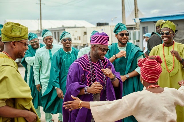Groom and Bride happy with family and friends. Luxury wedding planned by Victoria Brooks Events in Nigeria with elegant décor and beautiful reception