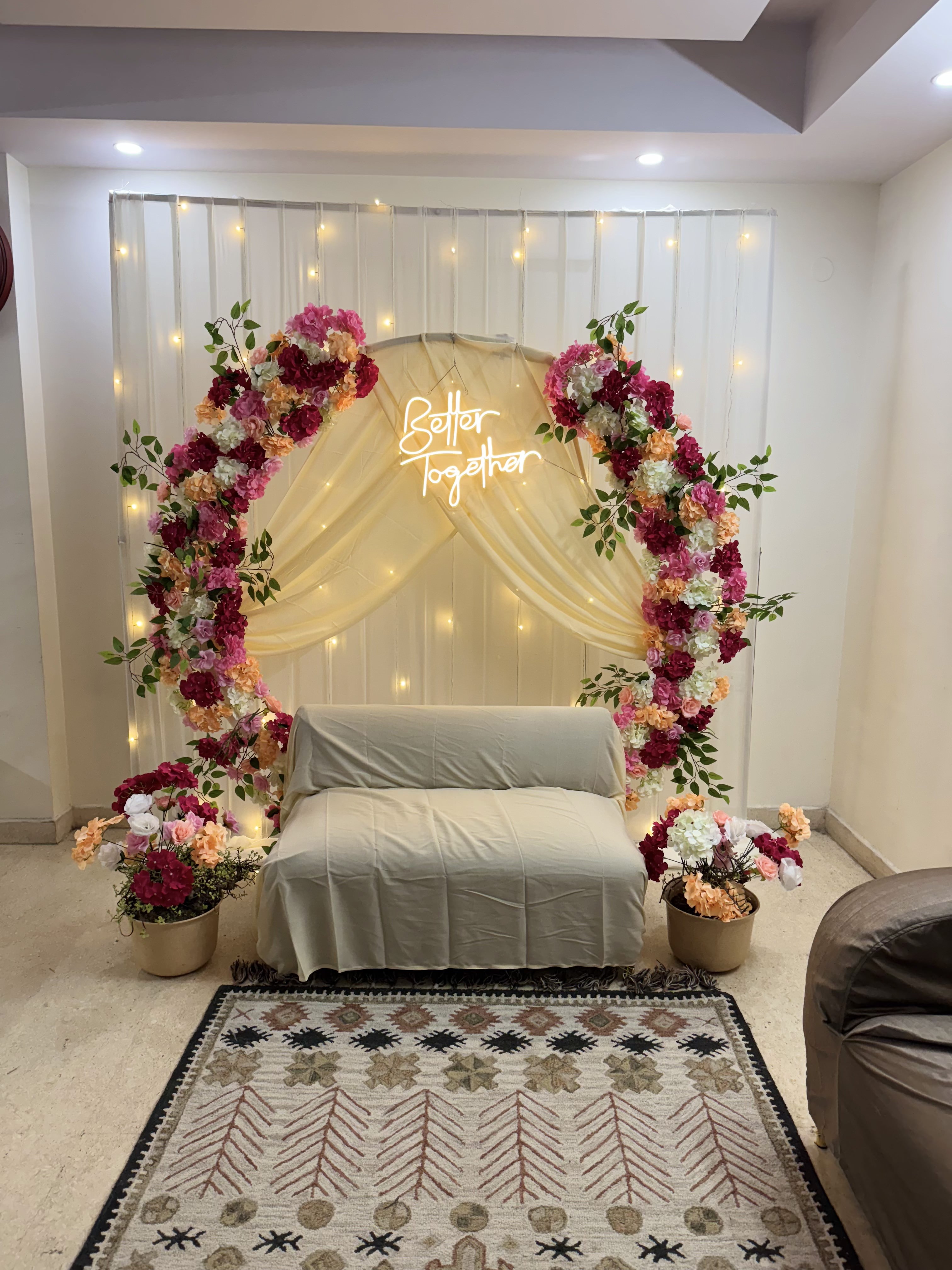 Ring decoration with pink, peach, & white flowers for roka or engagement ceremony at home in Paschim Vihar & Rajouri Garden