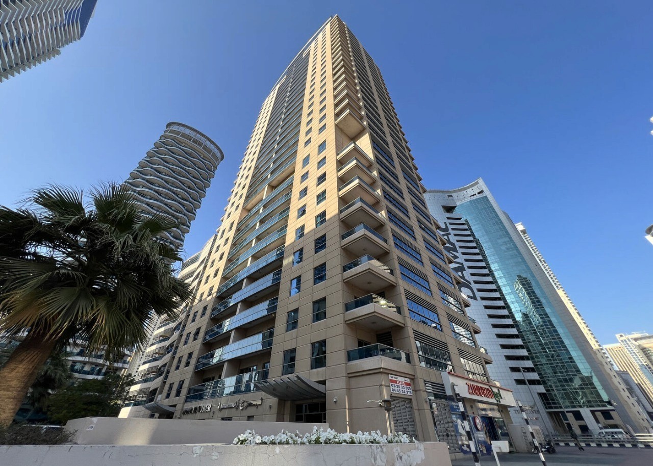 High-angle shot of Zumurud Tower showcasing the sleek residential architecture in Dubai Marina.