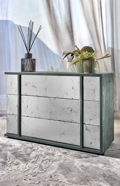 side view of a leather covered cube chest of drawer and eglomisè glass