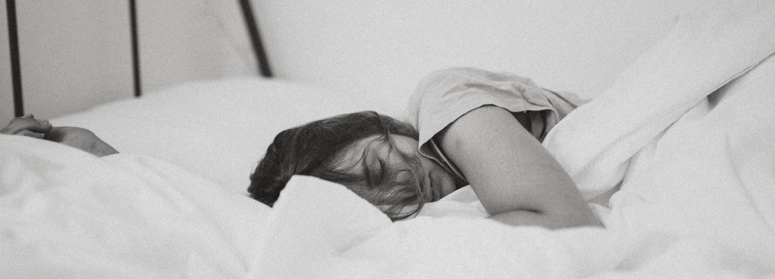 a woman sleeping in bed