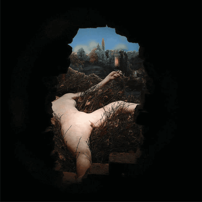 A naked person lying in the ground
Description automatically generated