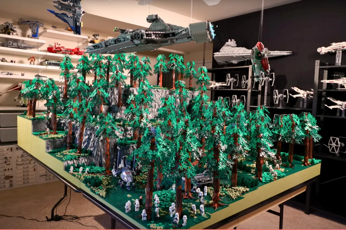 A highly detailed LEGO Star Wars Daro diorama featuring towering trees, Imperial forces, and the Bad Batch, set in a dedicated LEGO collector’s room with shelves displaying various Star Wars ships and models.