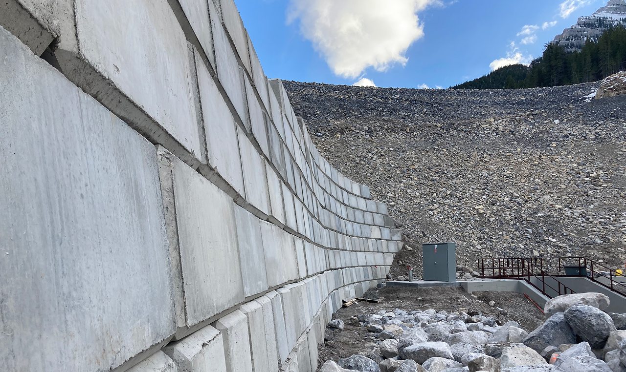 Seven-meter lock block retaining wall with geogrid reinforcement at Cougar Creek Dam access road