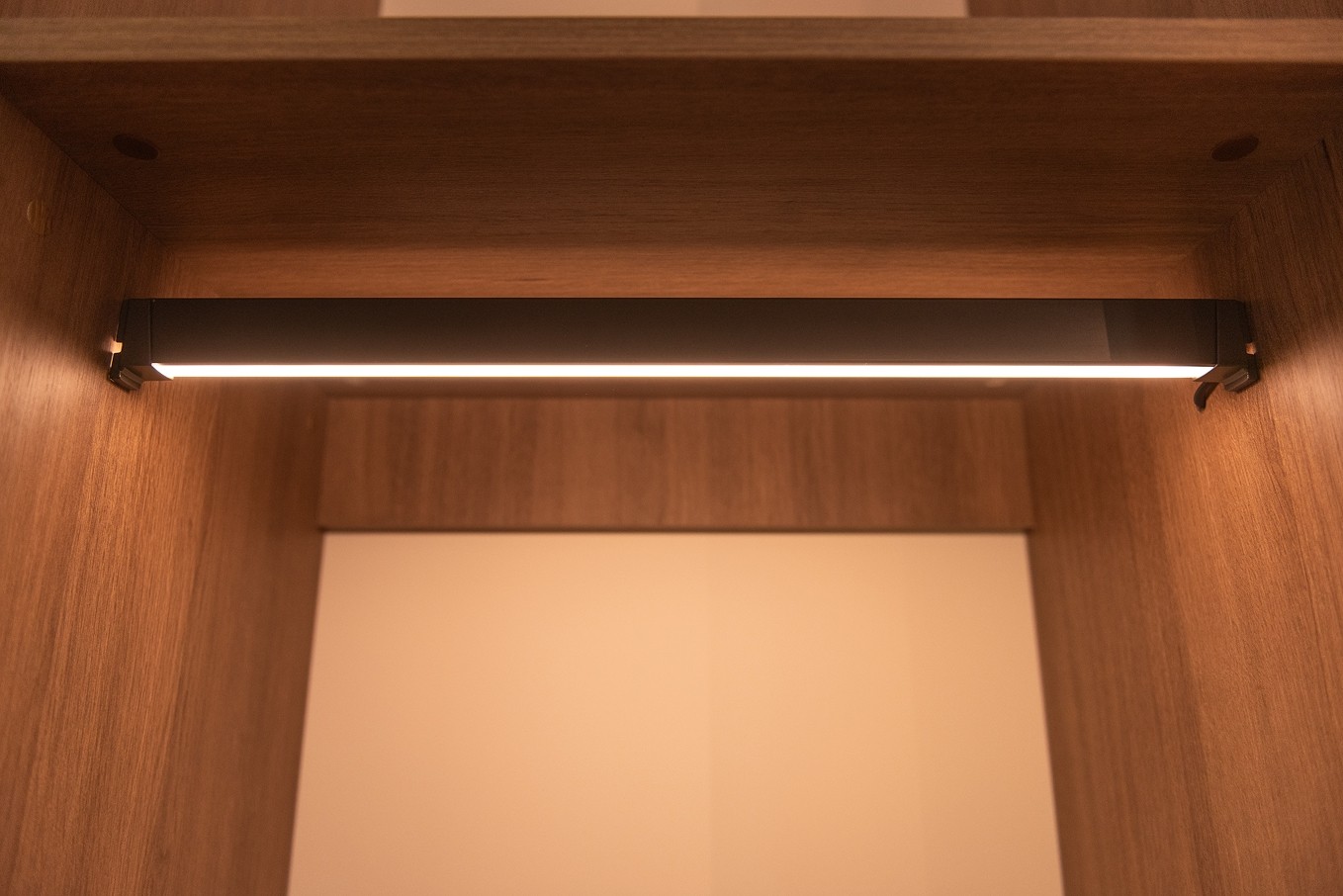Recessed wood shelf with integrated lighting