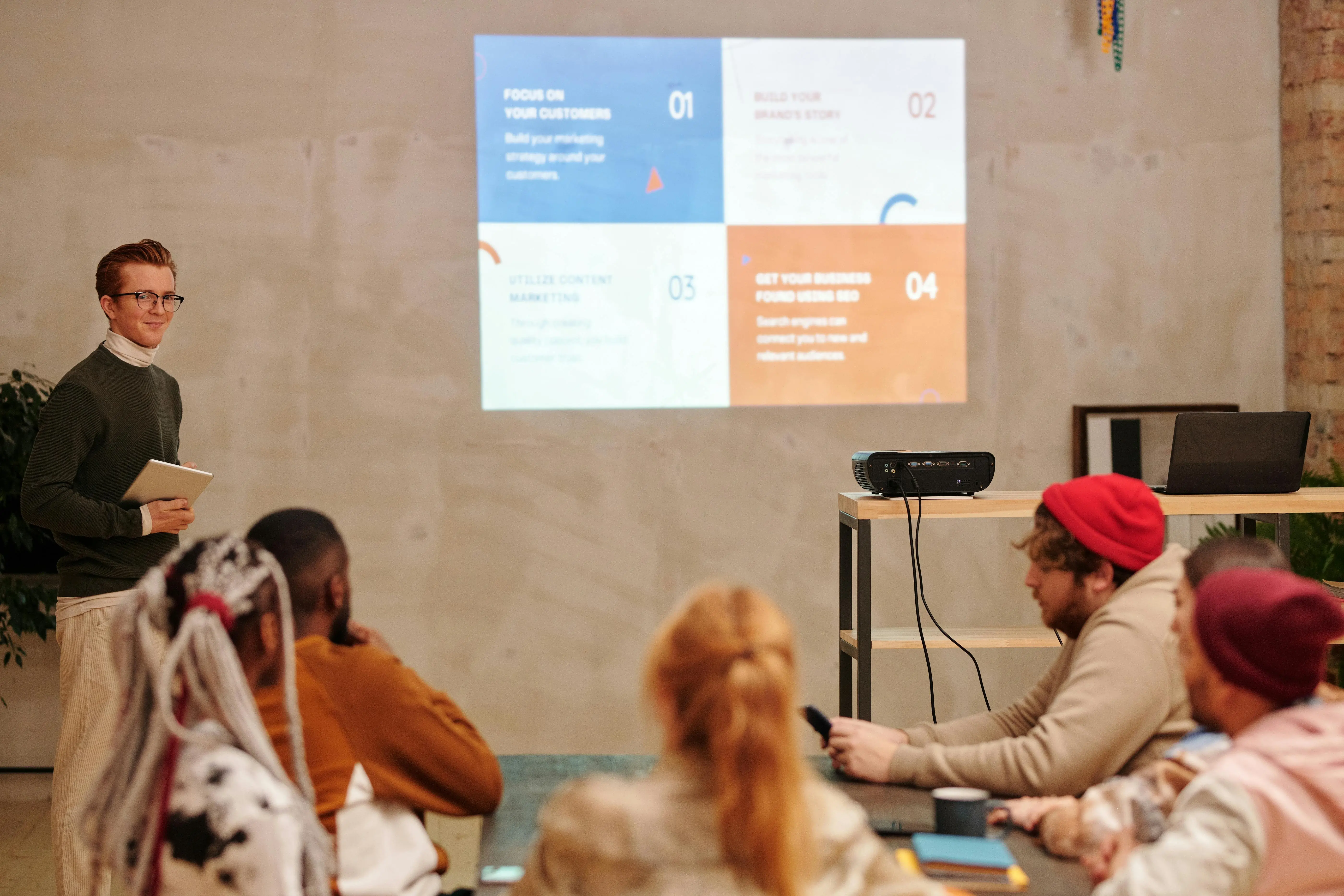Female scientist in gloves using a microscope beside test tubes, with overlay text about merging biotech, AI, and human-centric research.
