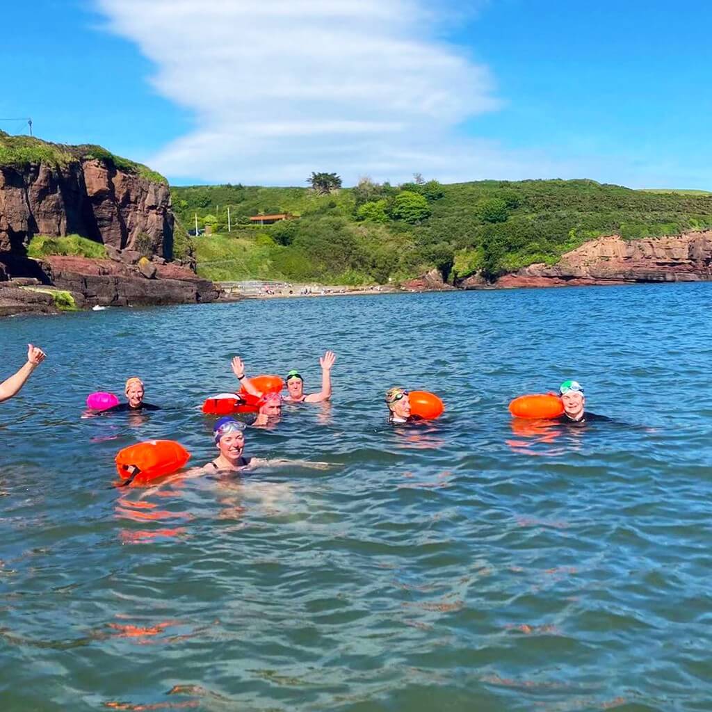 Members enjoying a dip on a sunny evening