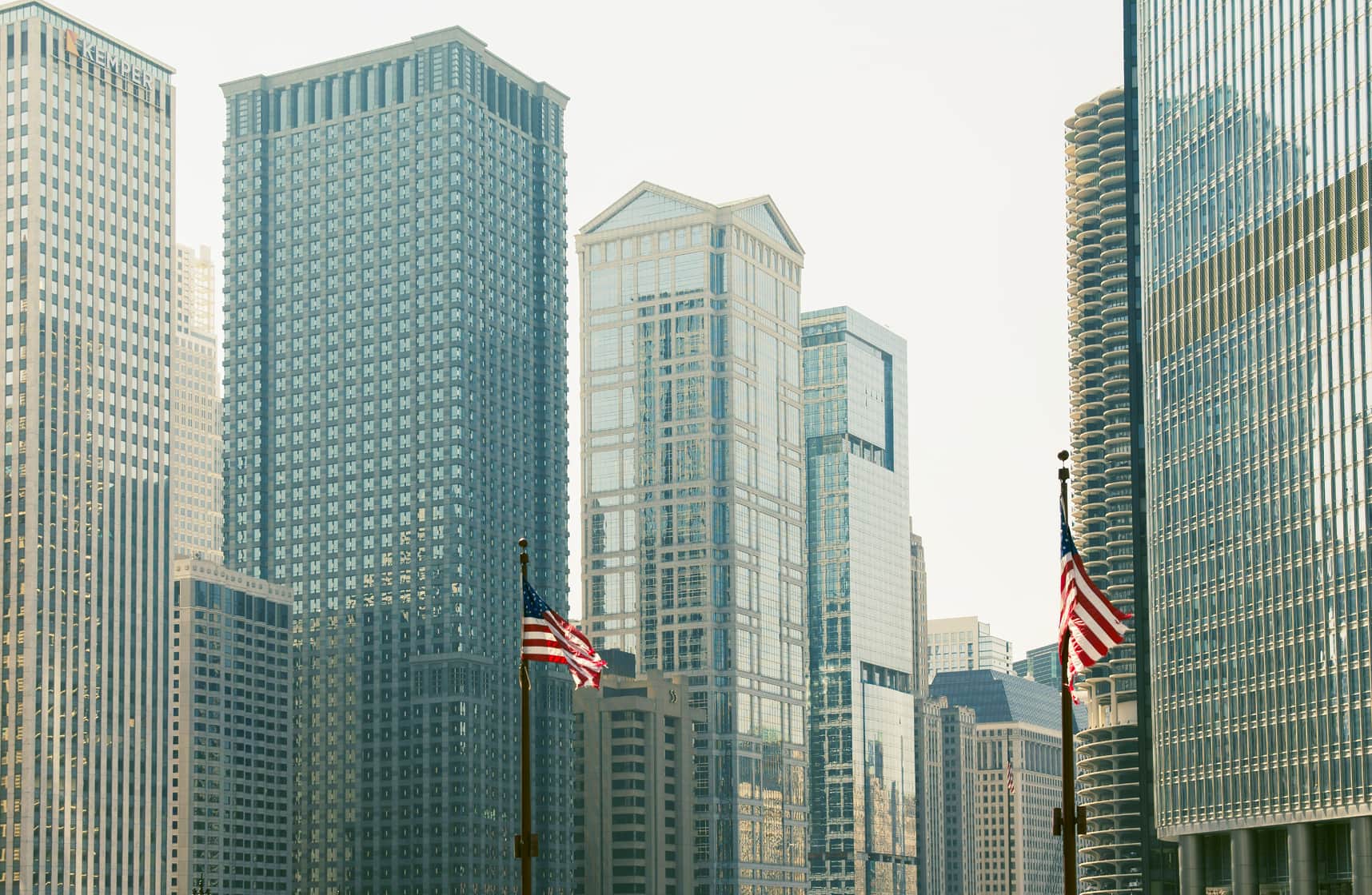 U.S. city skyline with American flags