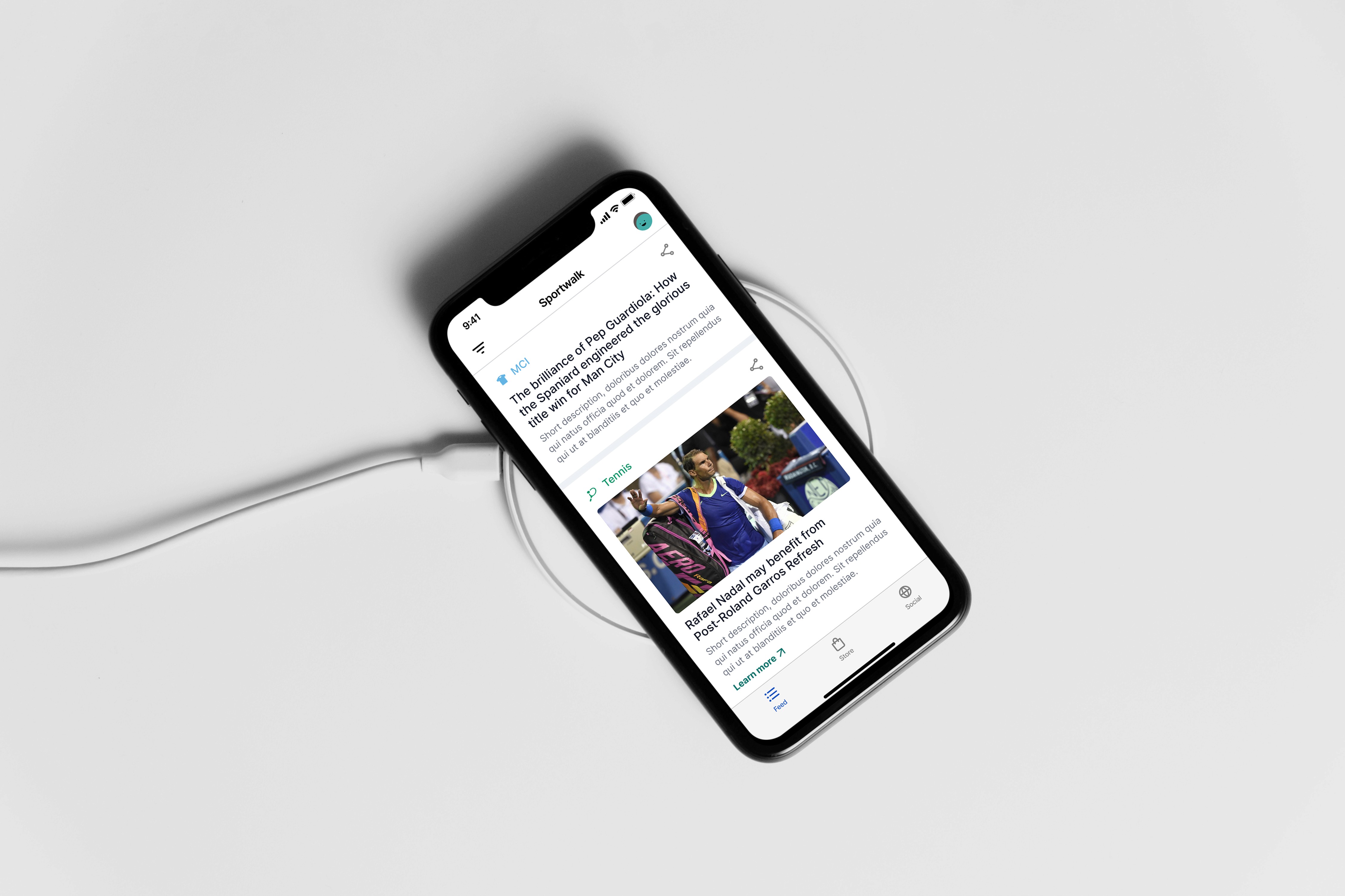 Mobile app interface showing sports news content on a smartphone placed on a wireless charger