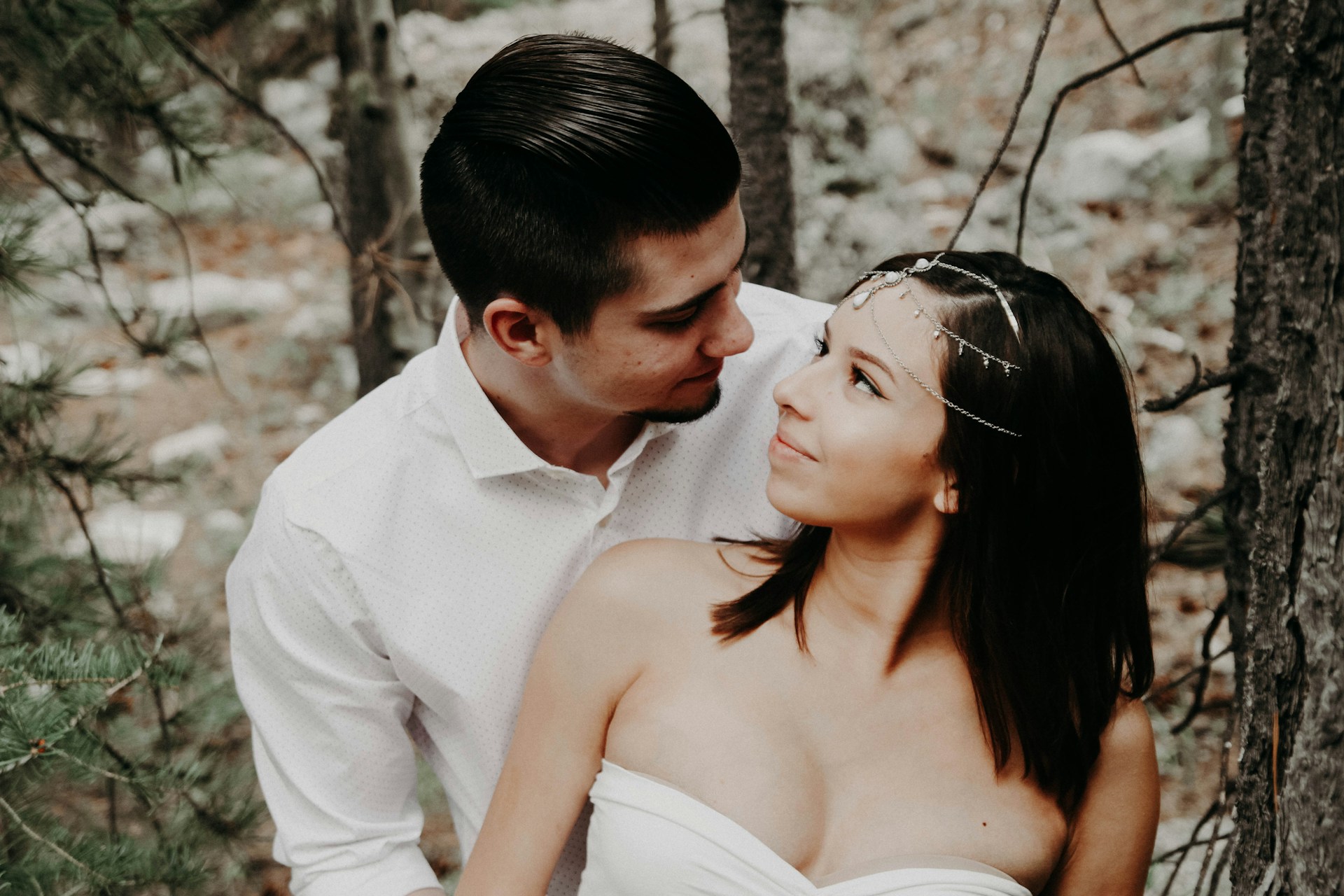 bride and groom posing in the forest