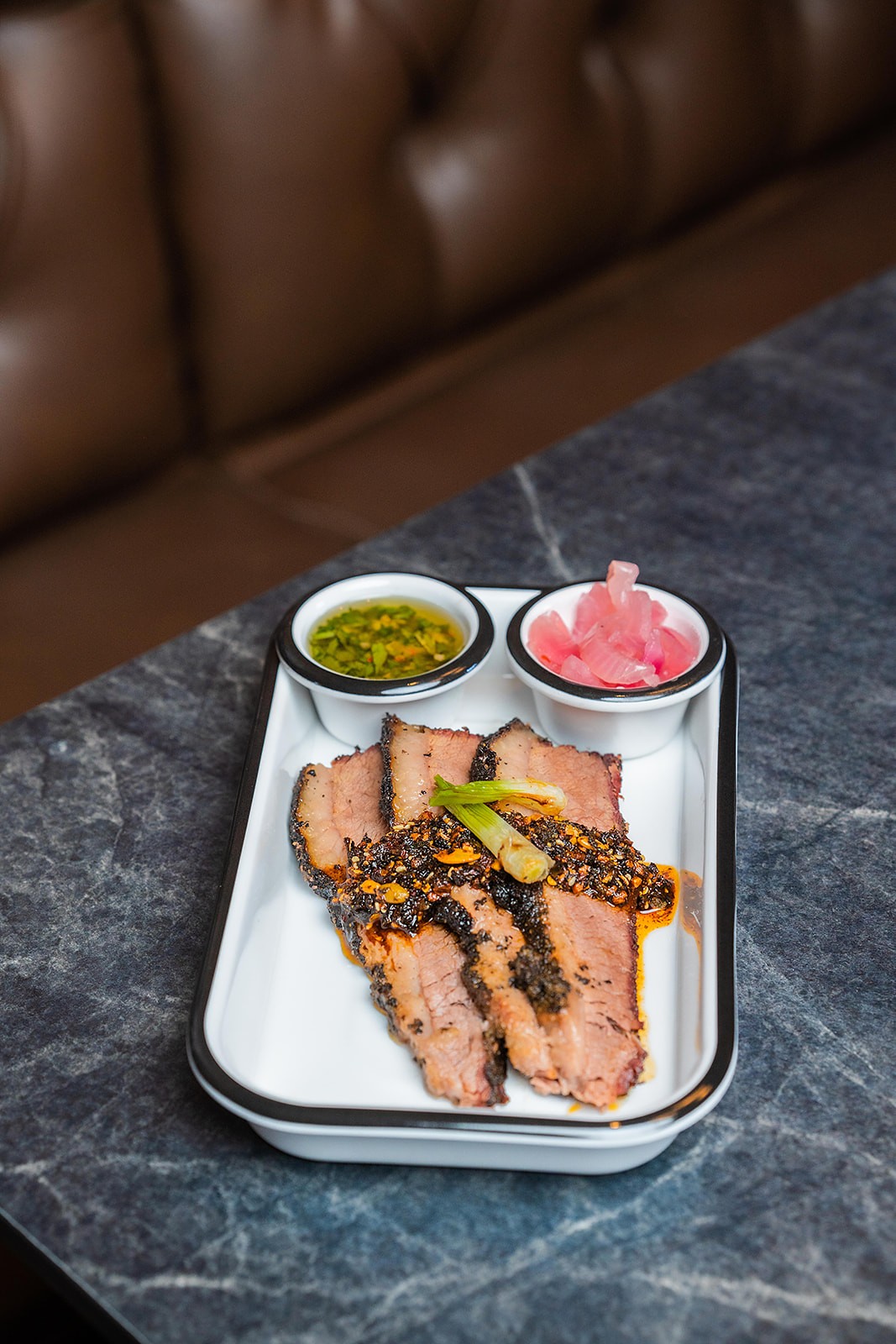 Oak and Ember plated barbecue meal with sides