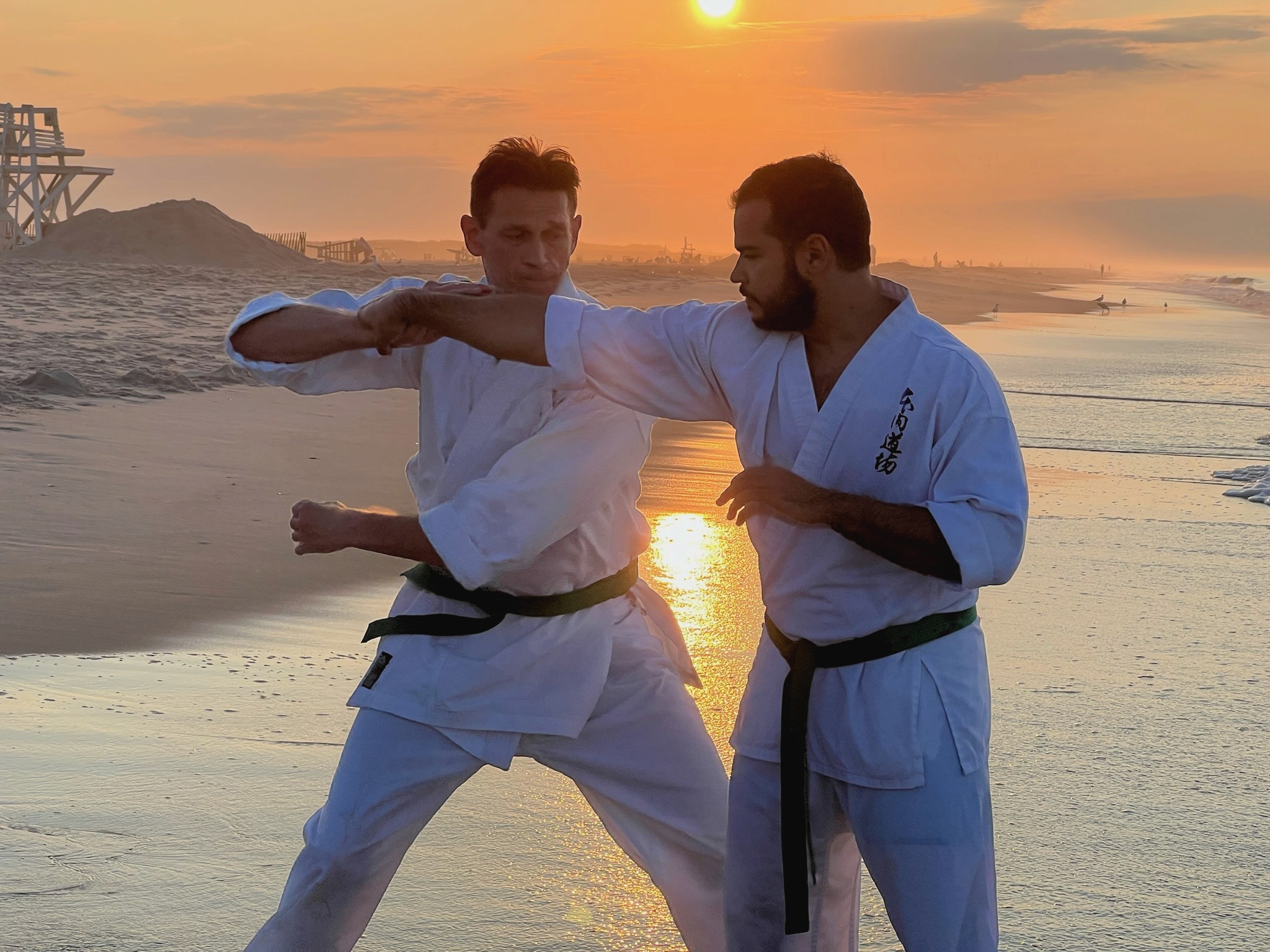 Woman in a beige turtleneck by an old computer and TV, retro 80s office portrait.
