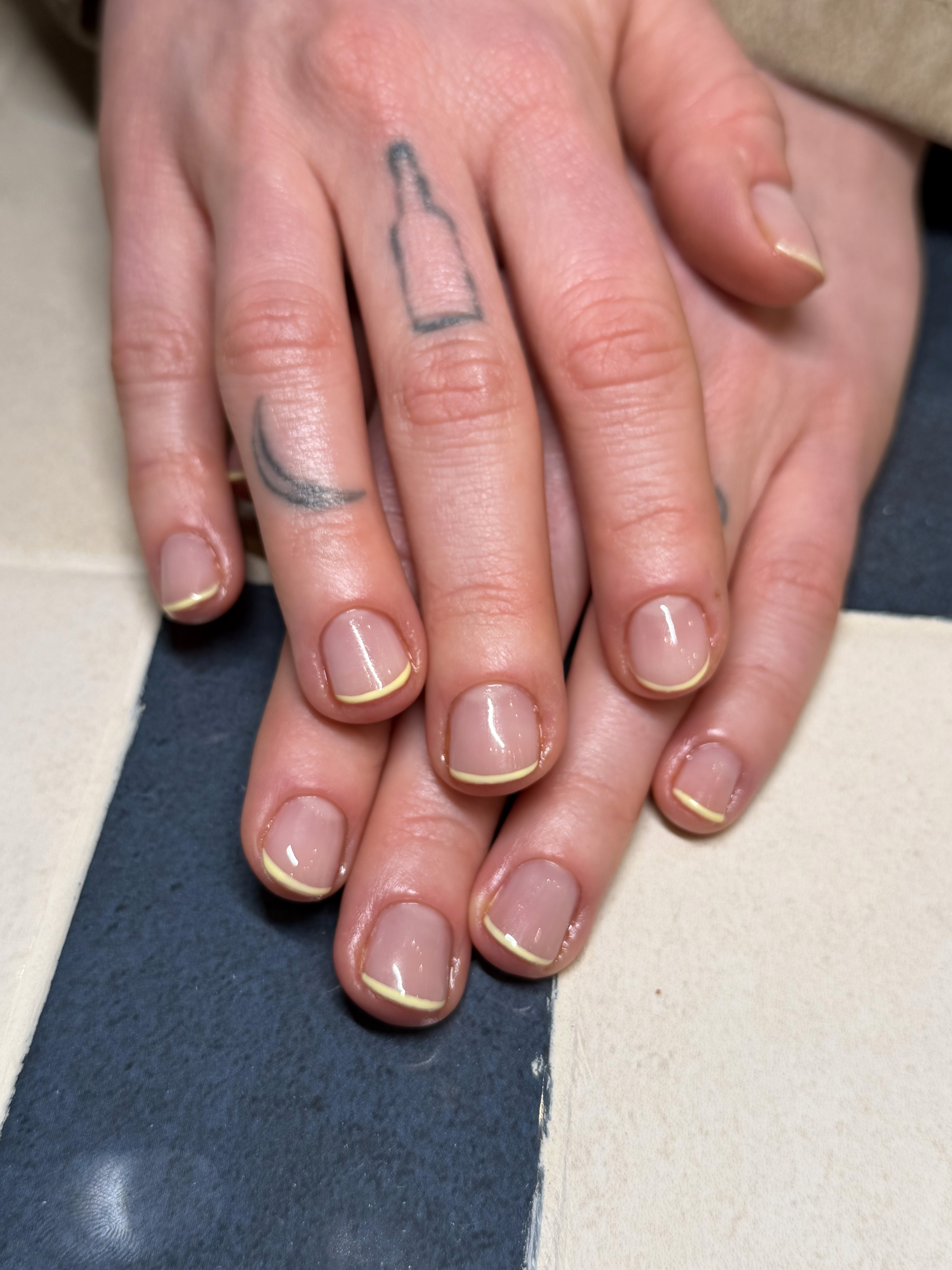 Short nude gel nails with pastel yellow French tip, nail art Berlin, Brava Nails Prenzlauer Berg