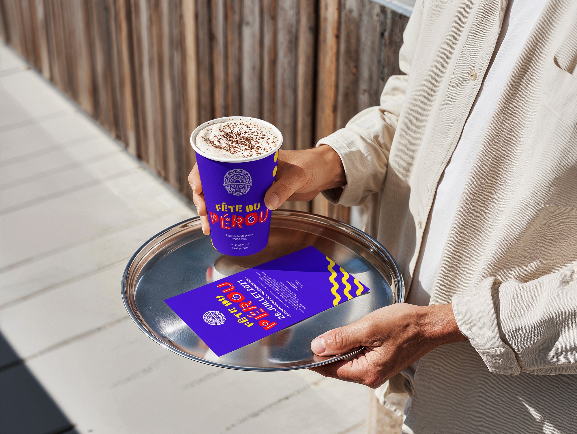Event application of Fiestas Patrias Peru identity, featuring custom typography on coffee cup and flyer, bringing cultural symbols into a real-life setting