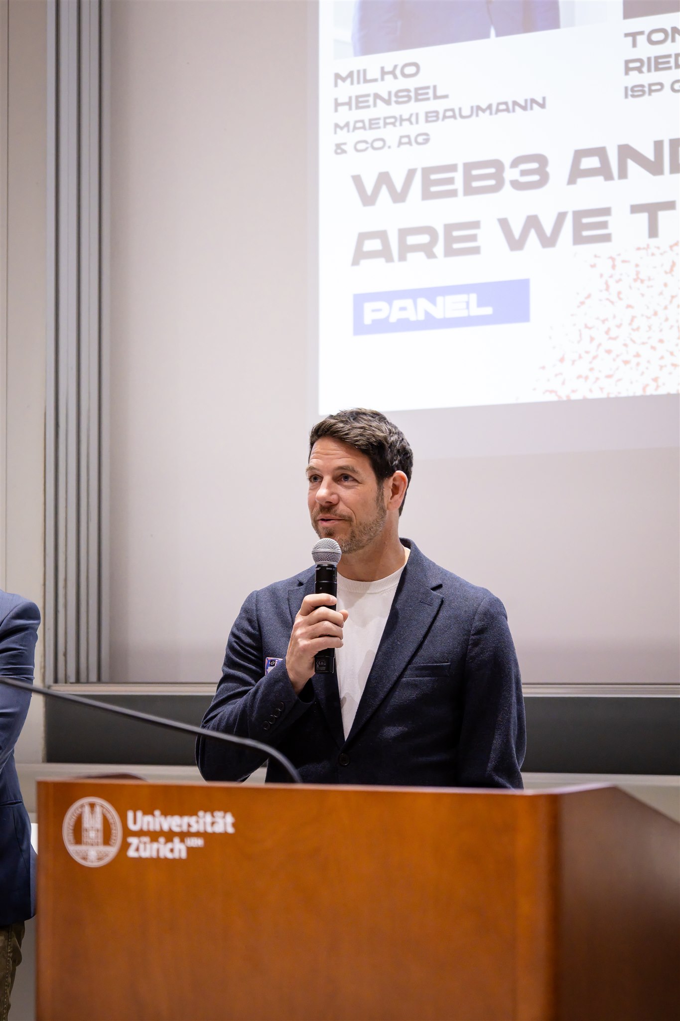 Speaker delivering talk at University of Zurich during EthereumZüri