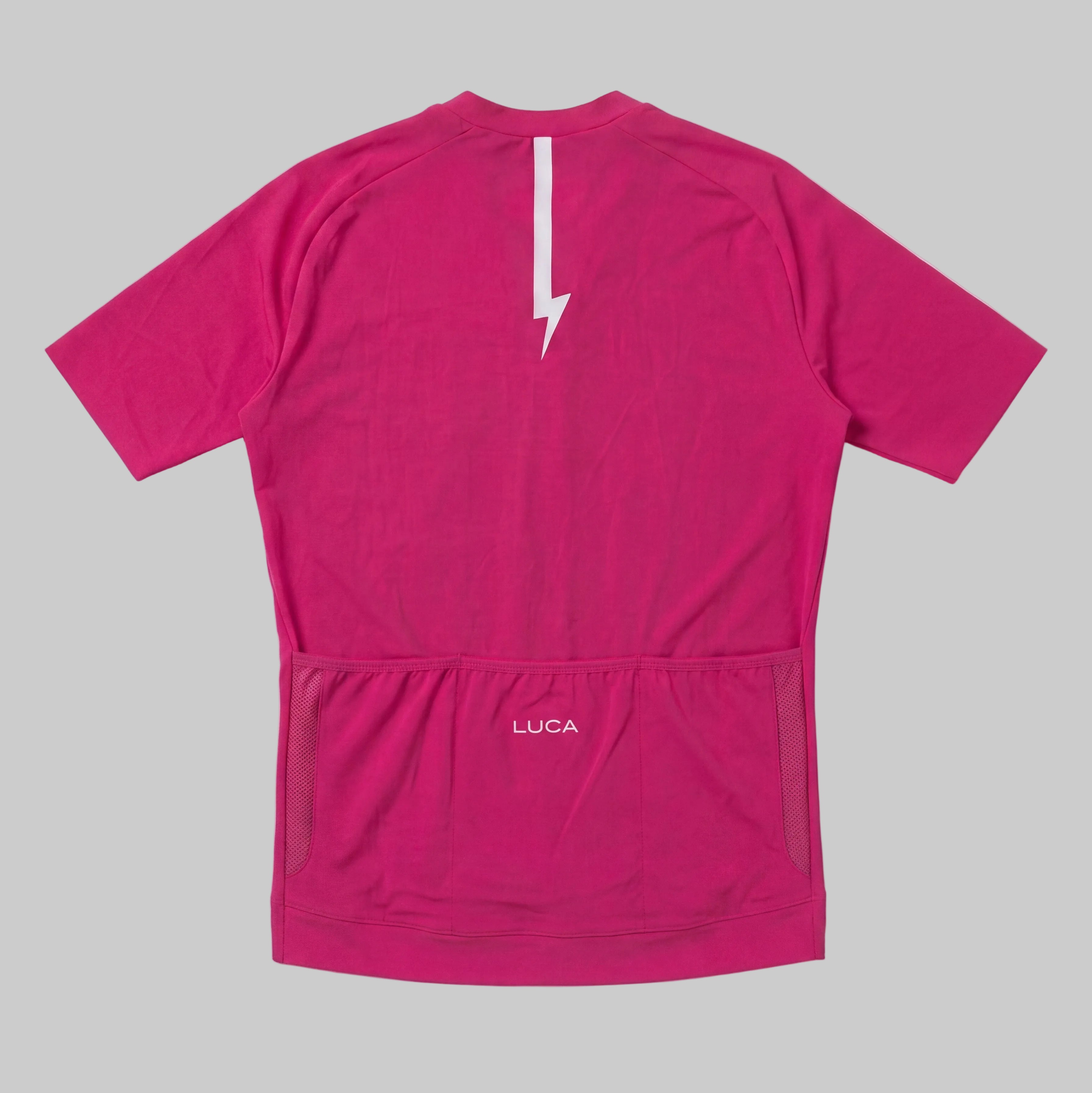 LUCA Soleil women's cycling jersey in hibiscus - back view with reflective bolt and pocket detail