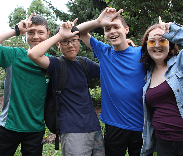 a large building with a dome on top of it surrounded by trees