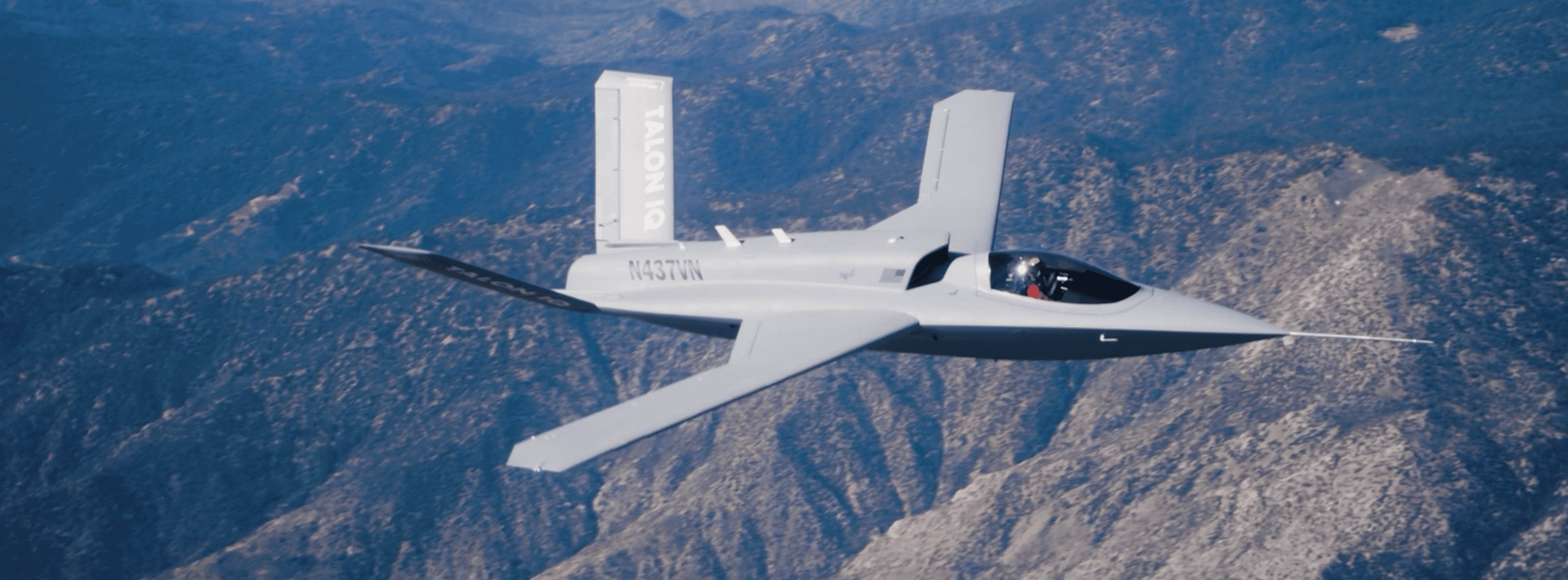 Northrop Grumman Model 437 Vanguard Talon IQ testbed in flight over desert mountains