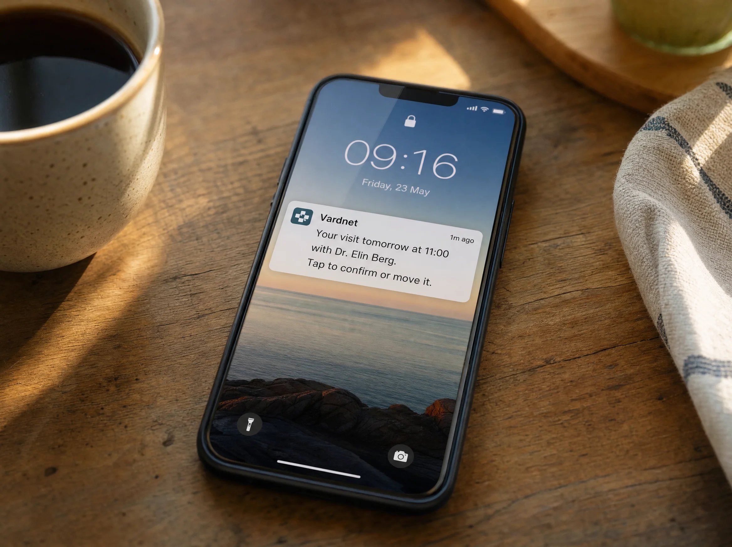 Phone lock screen with a Vardnet reminder for a visit tomorrow at 11:00