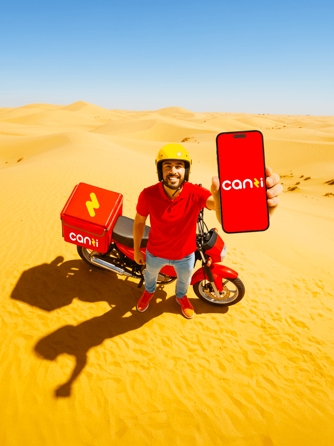 Canzi Tlebha f tawani tweslek f daqayeq social media campaign design man in sahara desert holding phone with canzi logo designed by mehdi meliani
