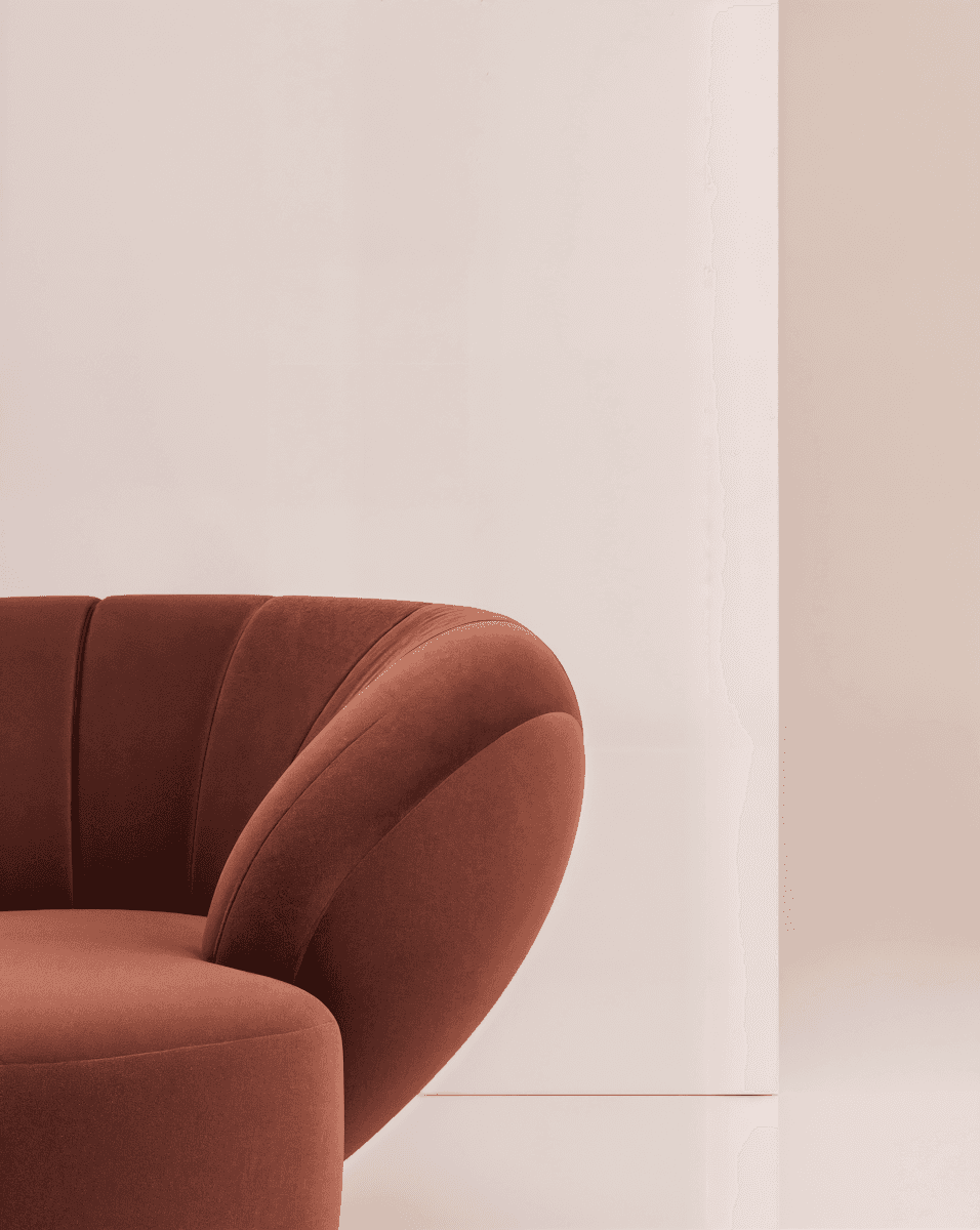 Close-up of a orange armchair with textured fabric.