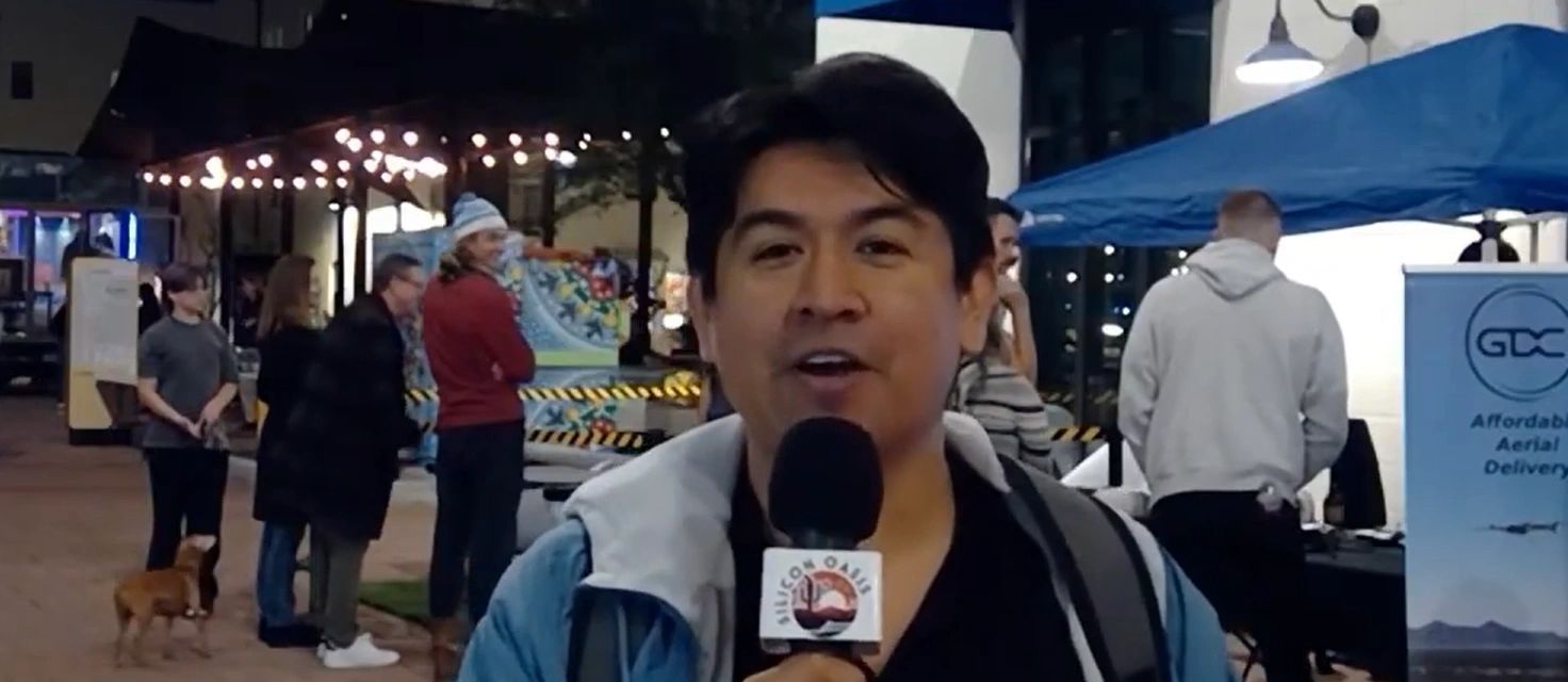a black and white living room with a large tv
