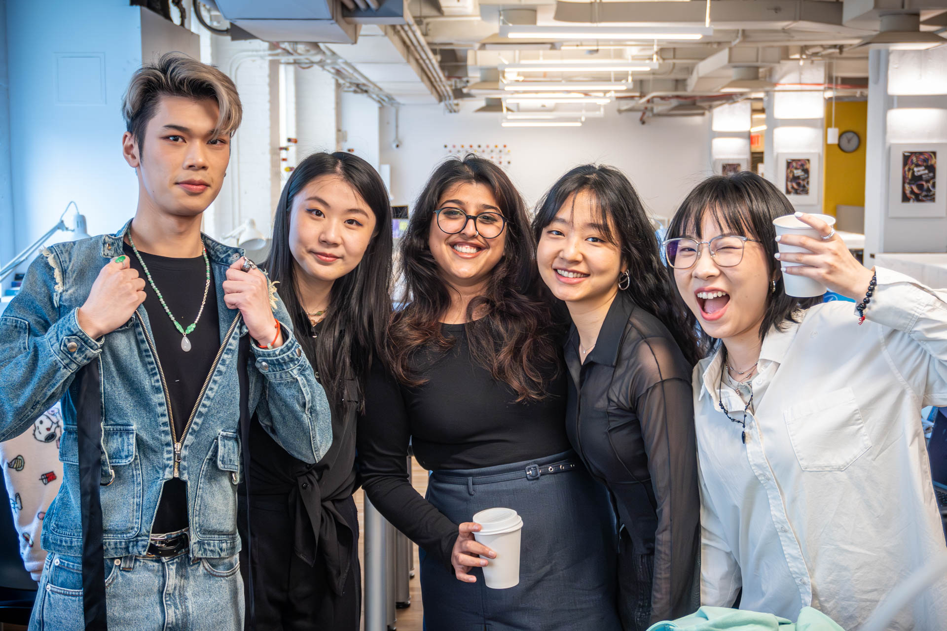 5 students posing and looking at the camera