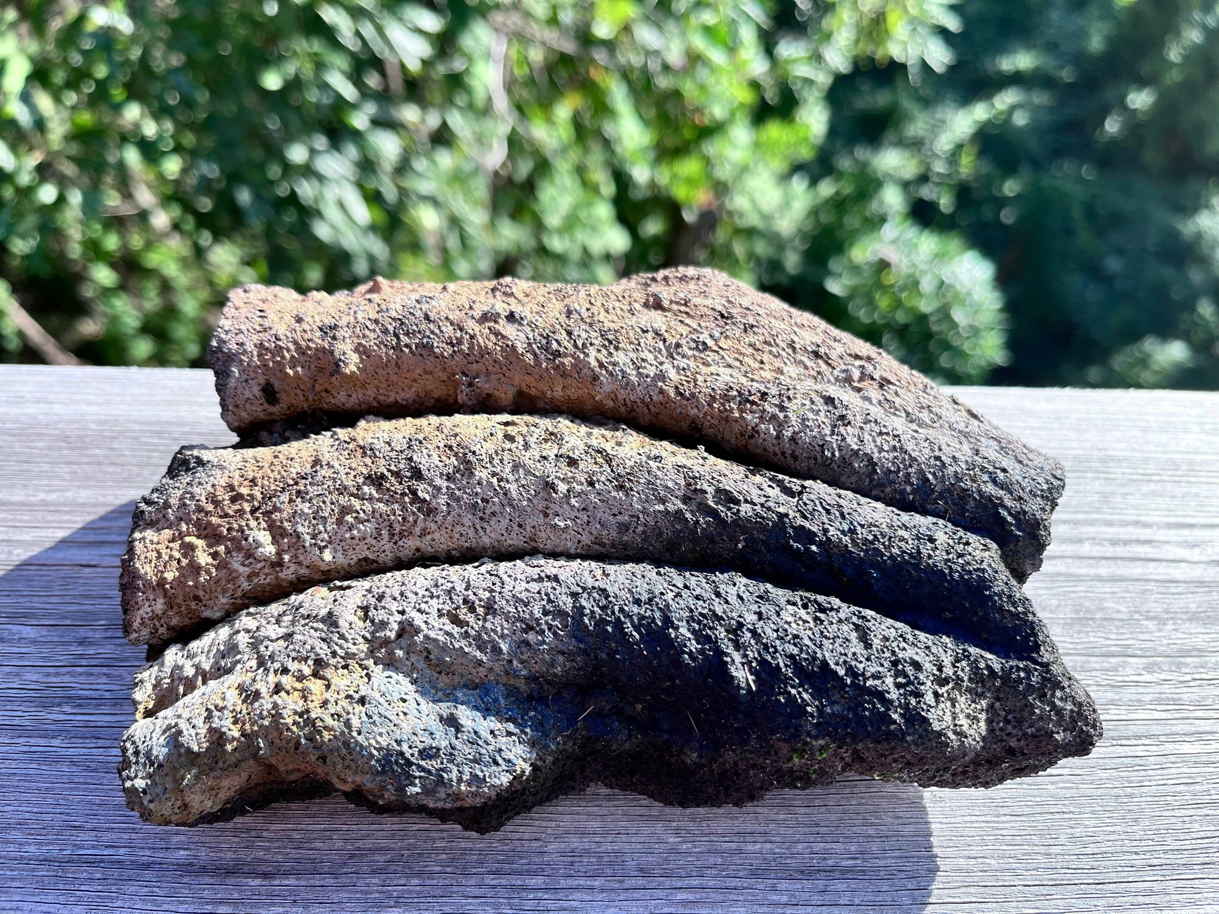 Lava stone formation with folded, layered appearance