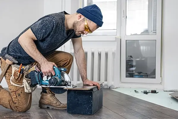Worker installing wood floors