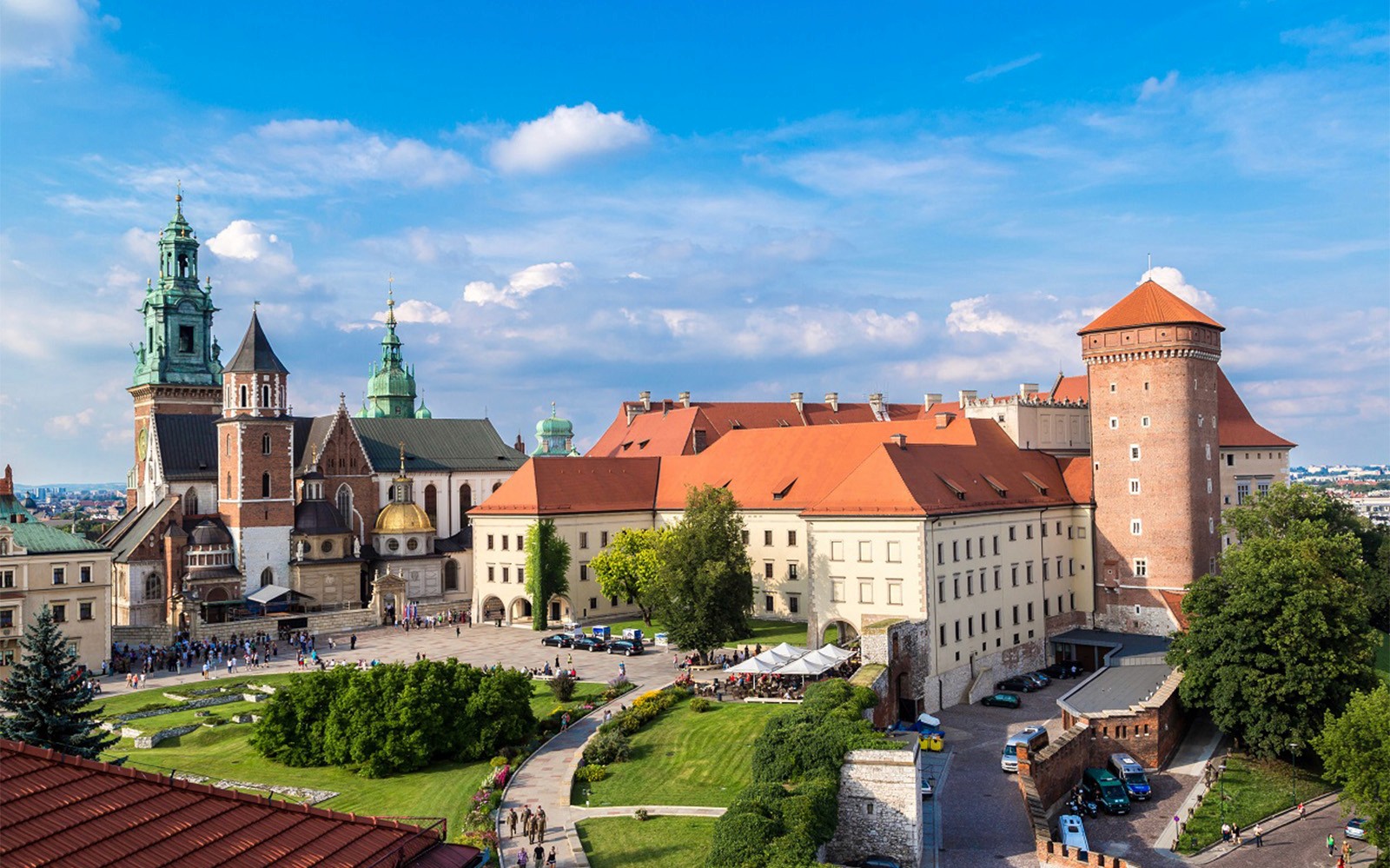 Wawel Castle complex in Krakow with cathedral towers and courtyard, part of guided tour.