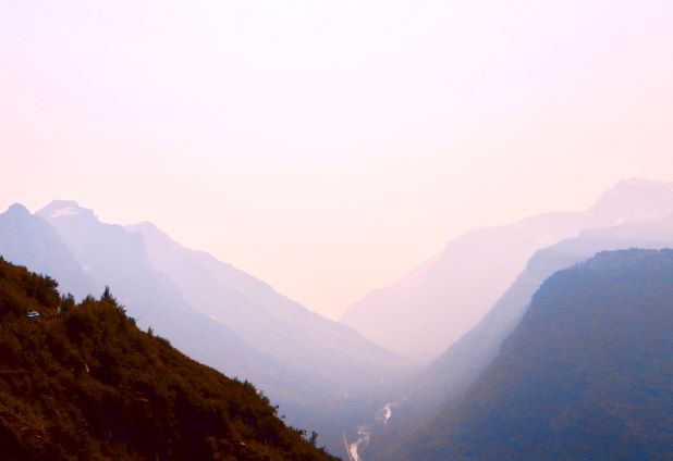 misty mountain scene in mauves and pinks